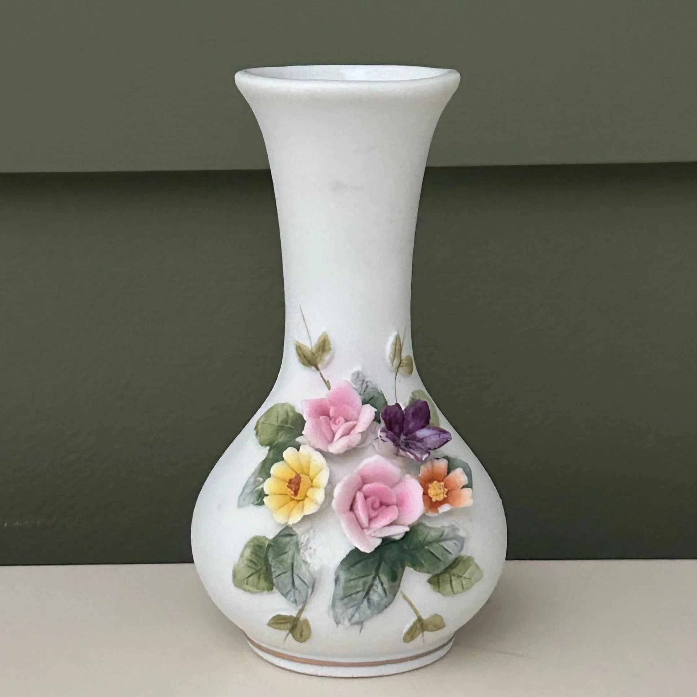 Small bud vase with pink, yellow, and purple hand-painted flowers