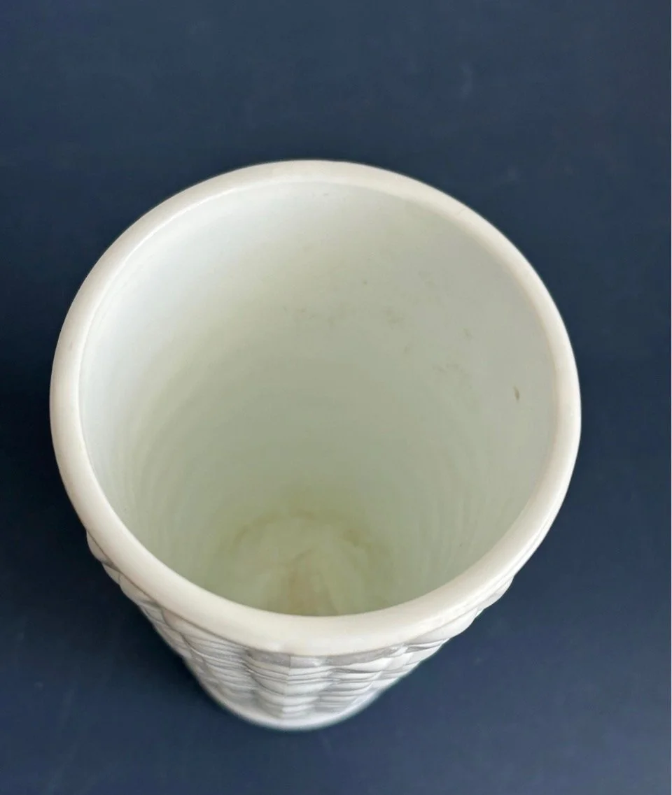 Interior of white grape relief vase showing pale staining and light surface marks