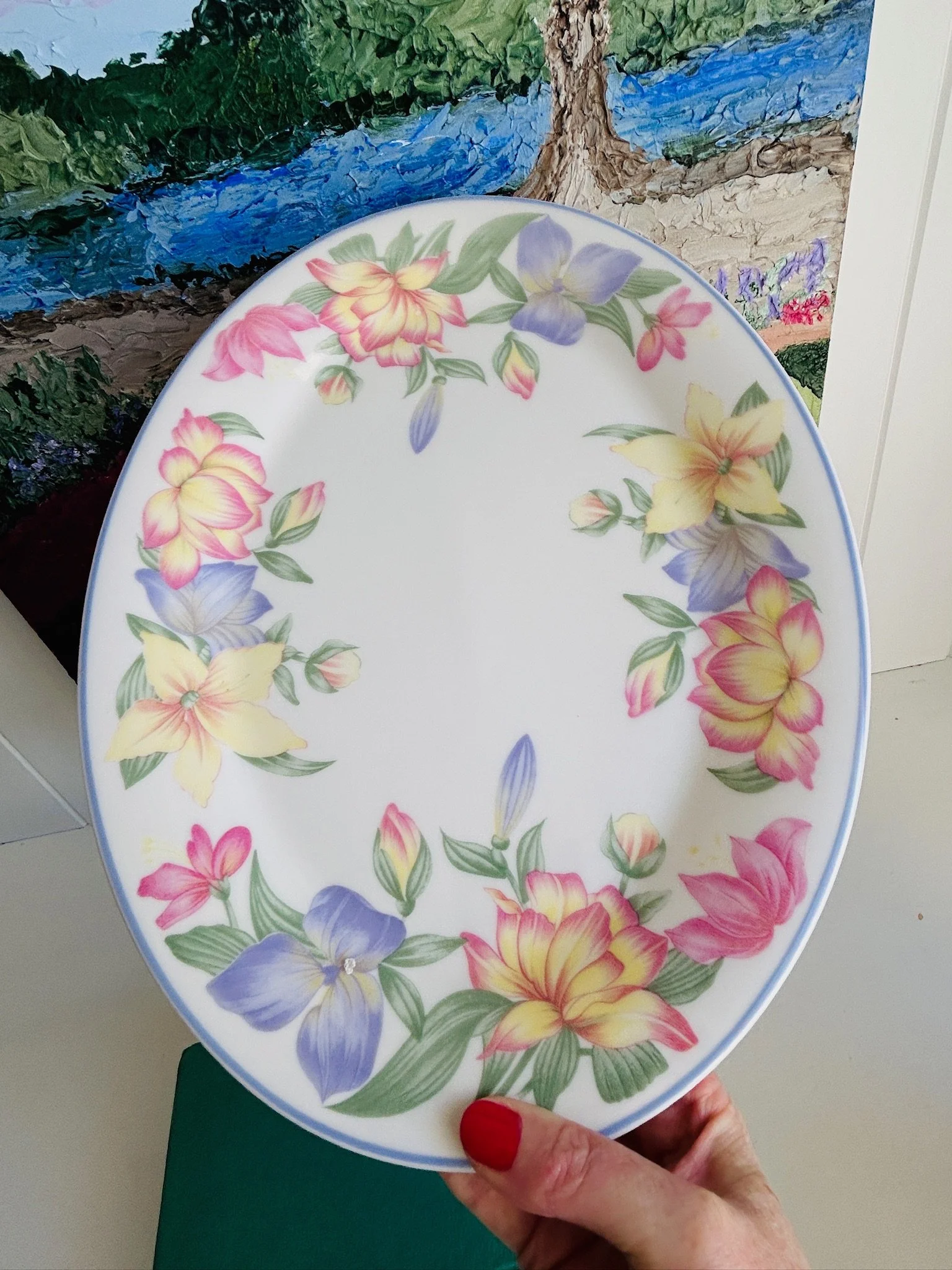 Overhead view of the Royal Doulton Expressions Blooms oval platter, highlighting the complete floral garland pattern and soft blue-violet rim