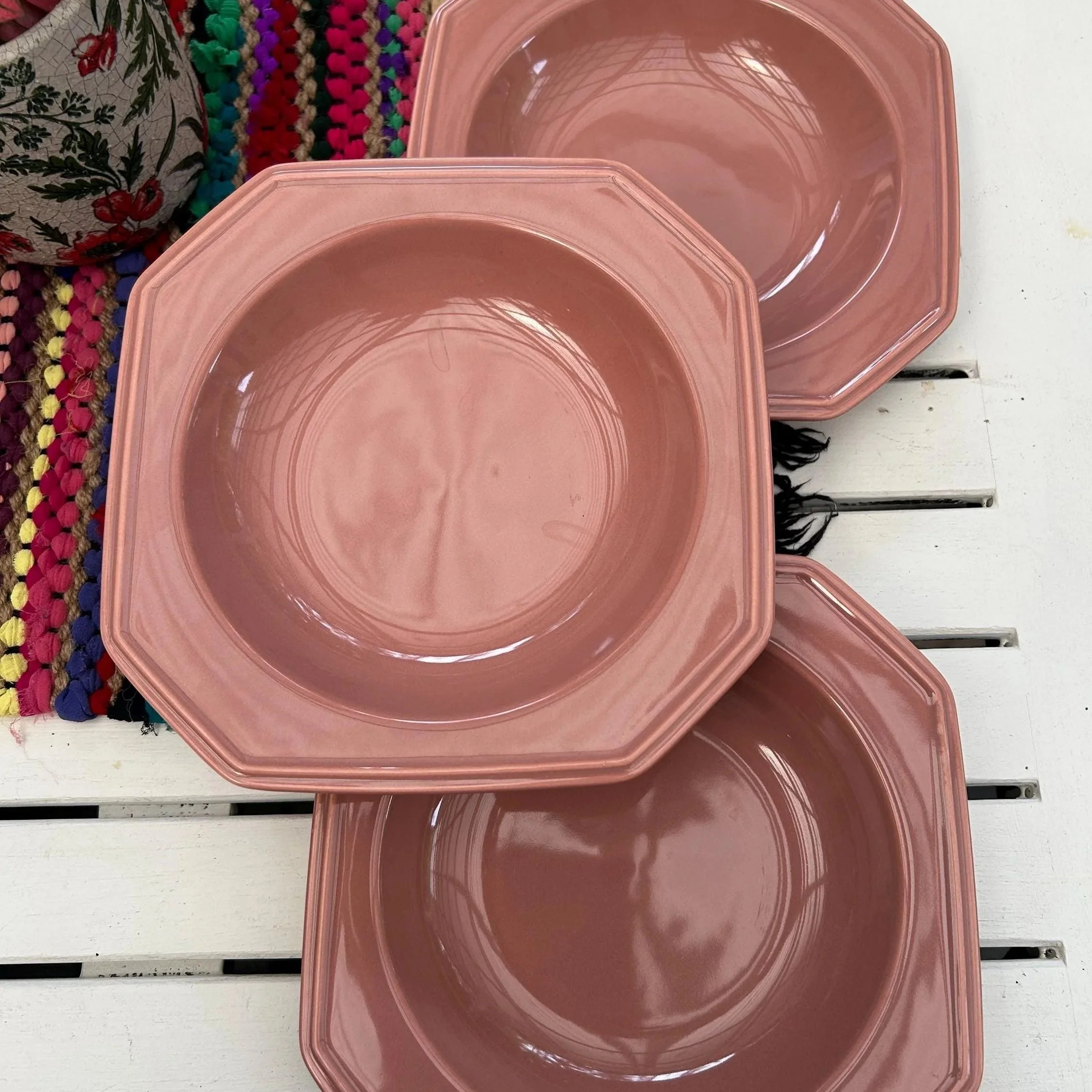 Overhead view of three stacked Mikasa Rose Gray soup bowls