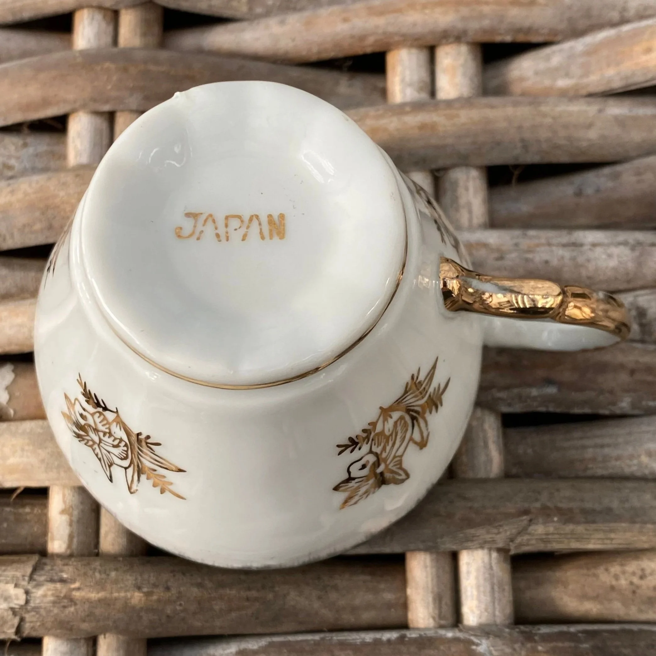 Base of teacup showing “Japan” mark and gold handle