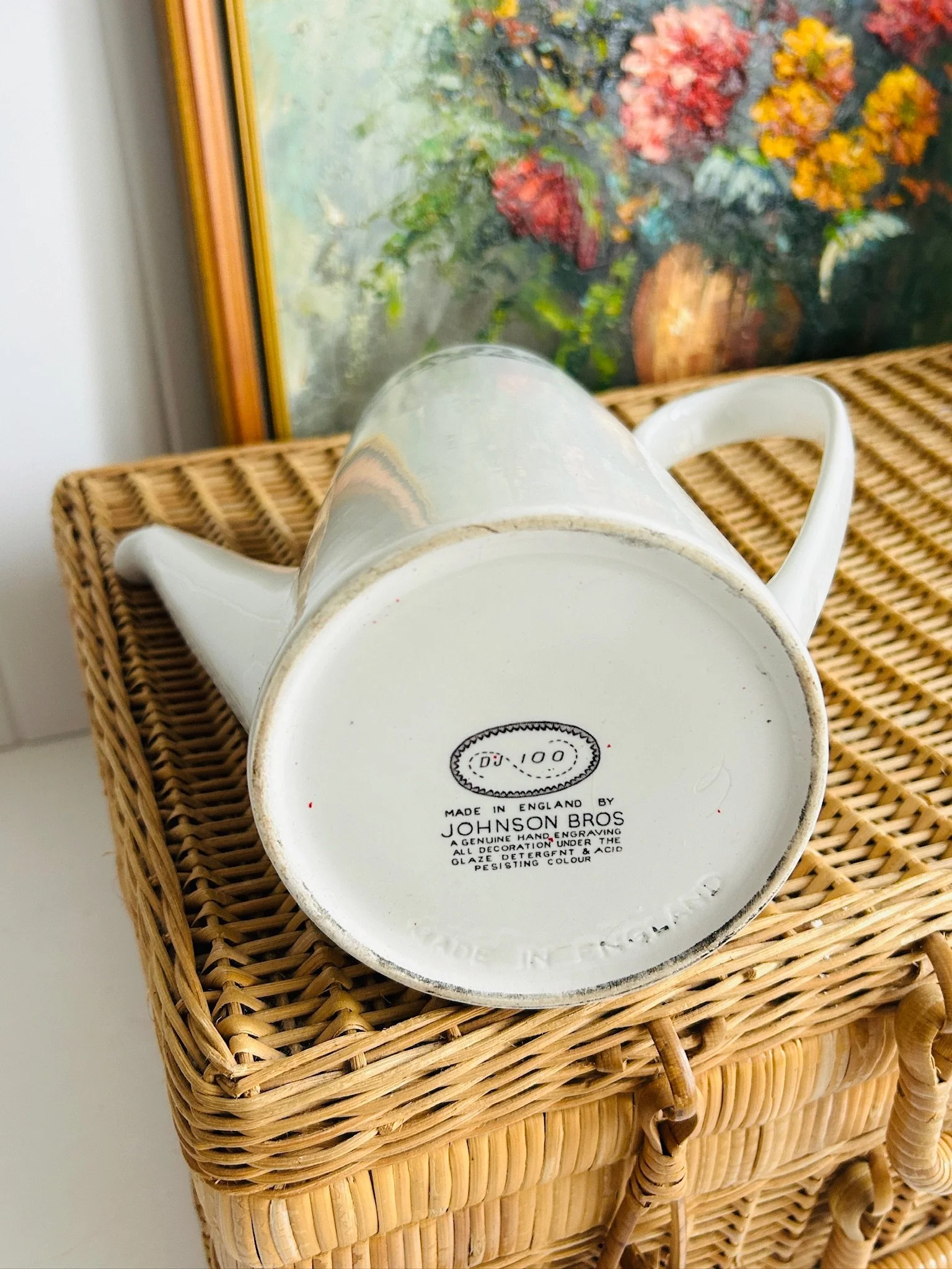 Underside view of the coffee pot resting on its side, featuring the Johnson Brothers backstamp on the white earthenware base.