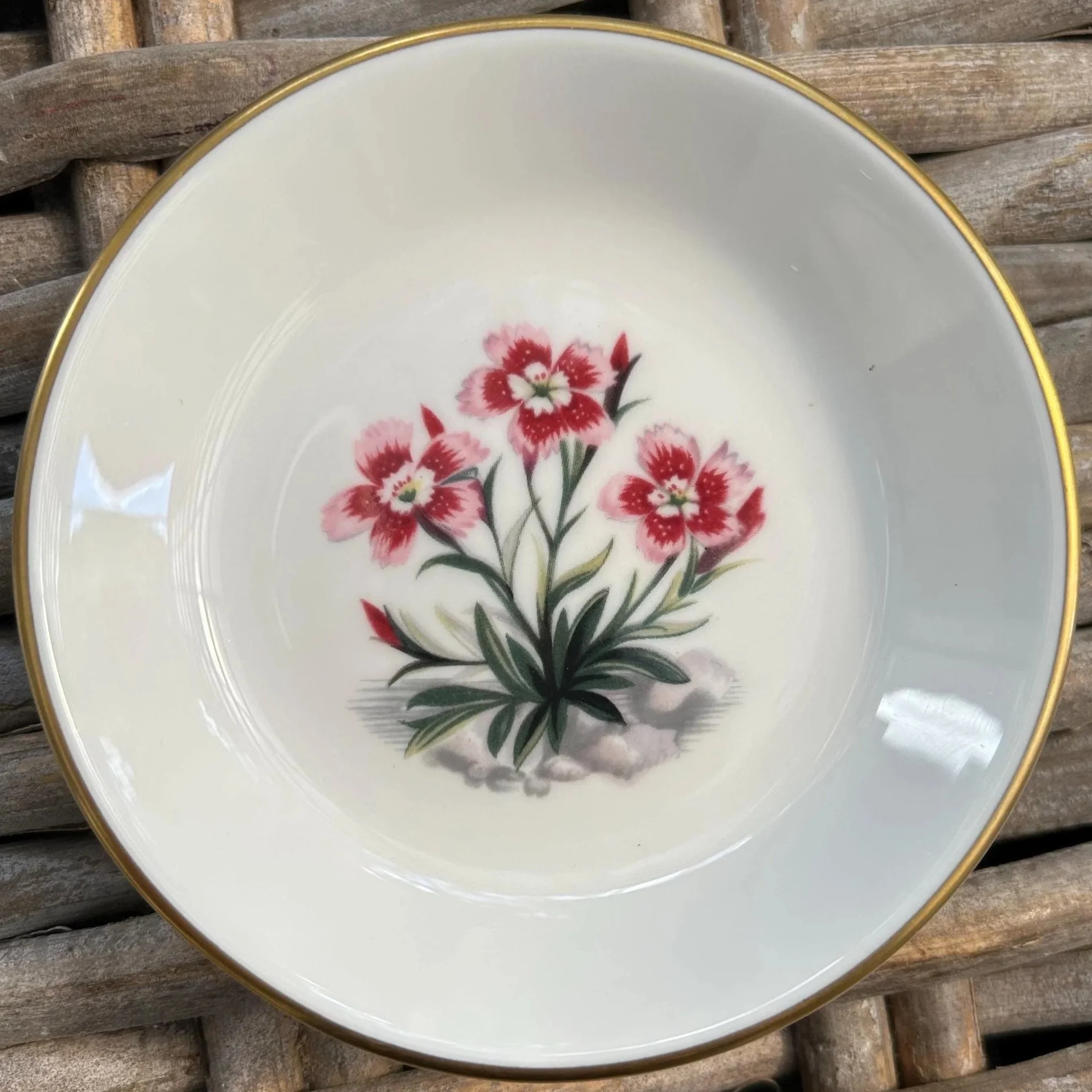Pink floral dish with two-toned pink blooms and gold border