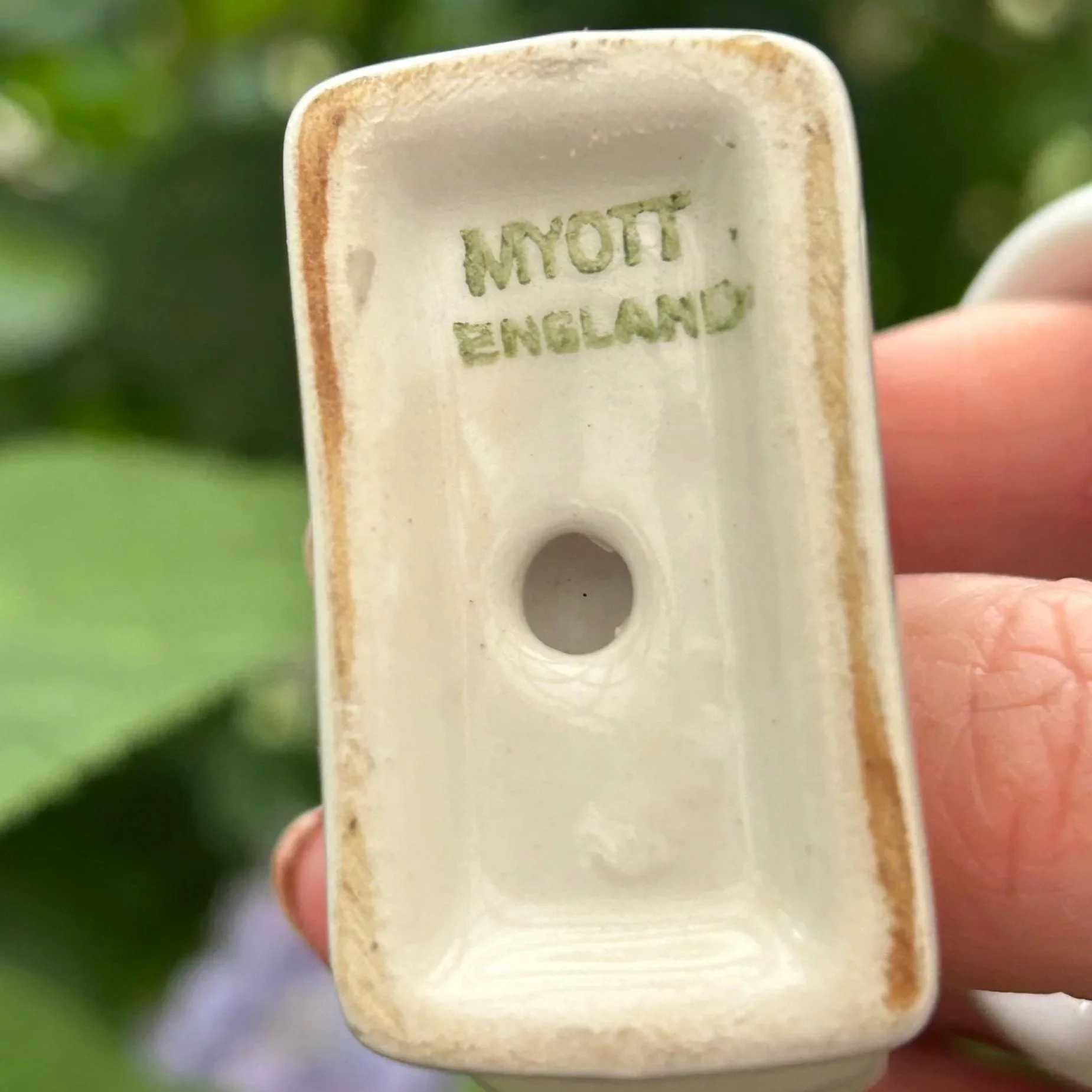 Underside of napkin ring stamped "MYOTT ENGLAND"