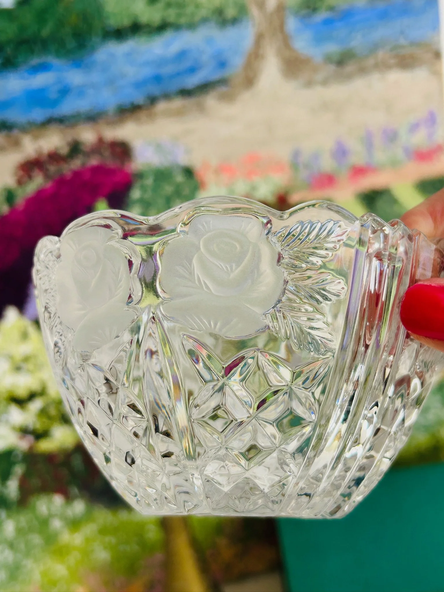 Side close-up of the crystal dish highlighting the frosted rose motifs, deep-cut diamond pattern, and thick clear glass body.