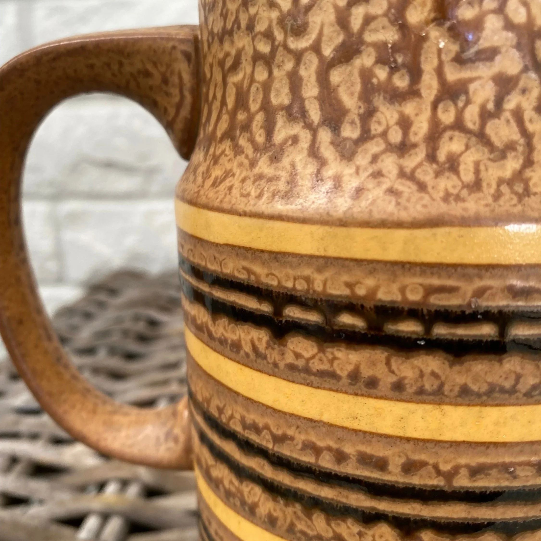 Handle detail of jug showing glaze texture and colour variation