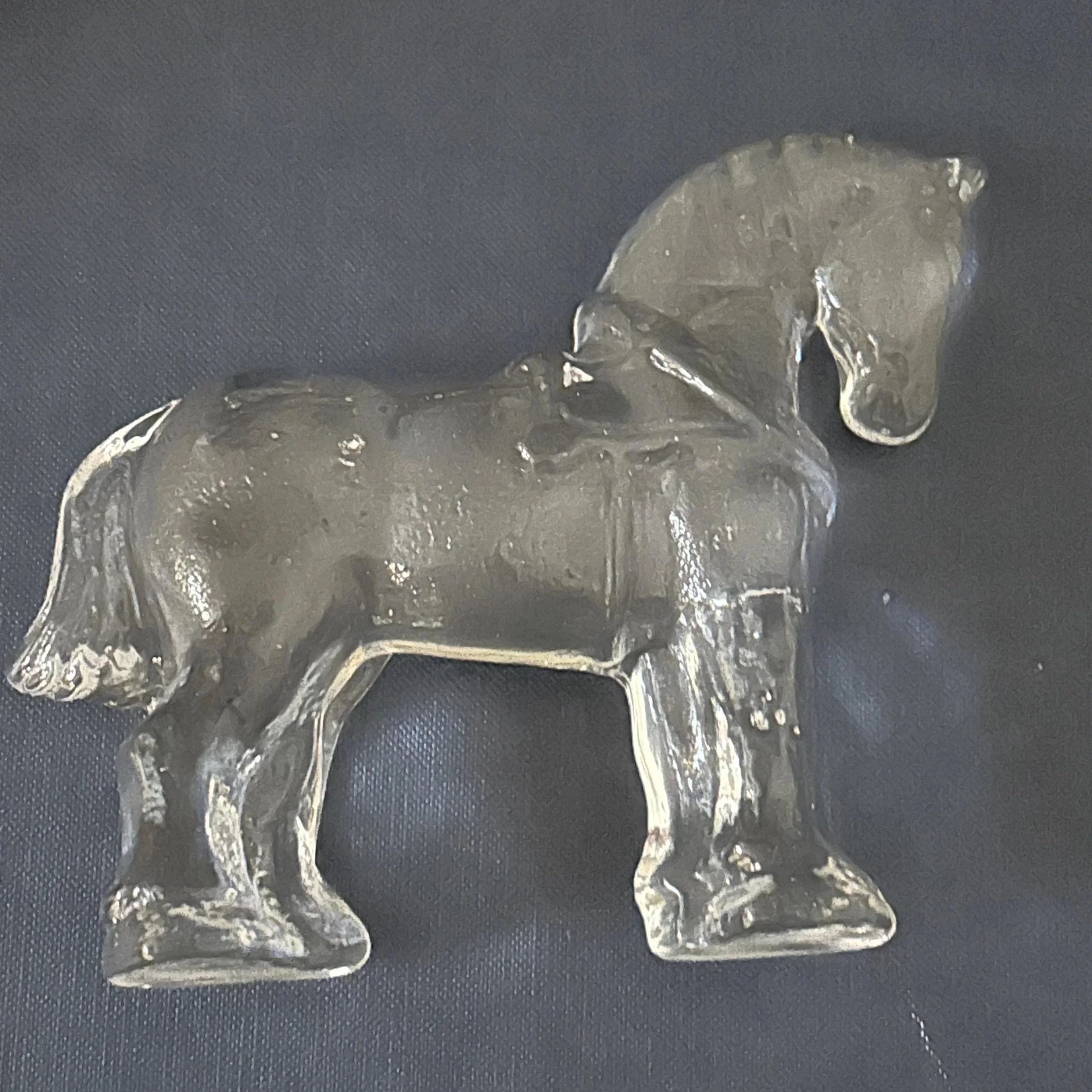 Flat side profile showing clear glass body and muscular form