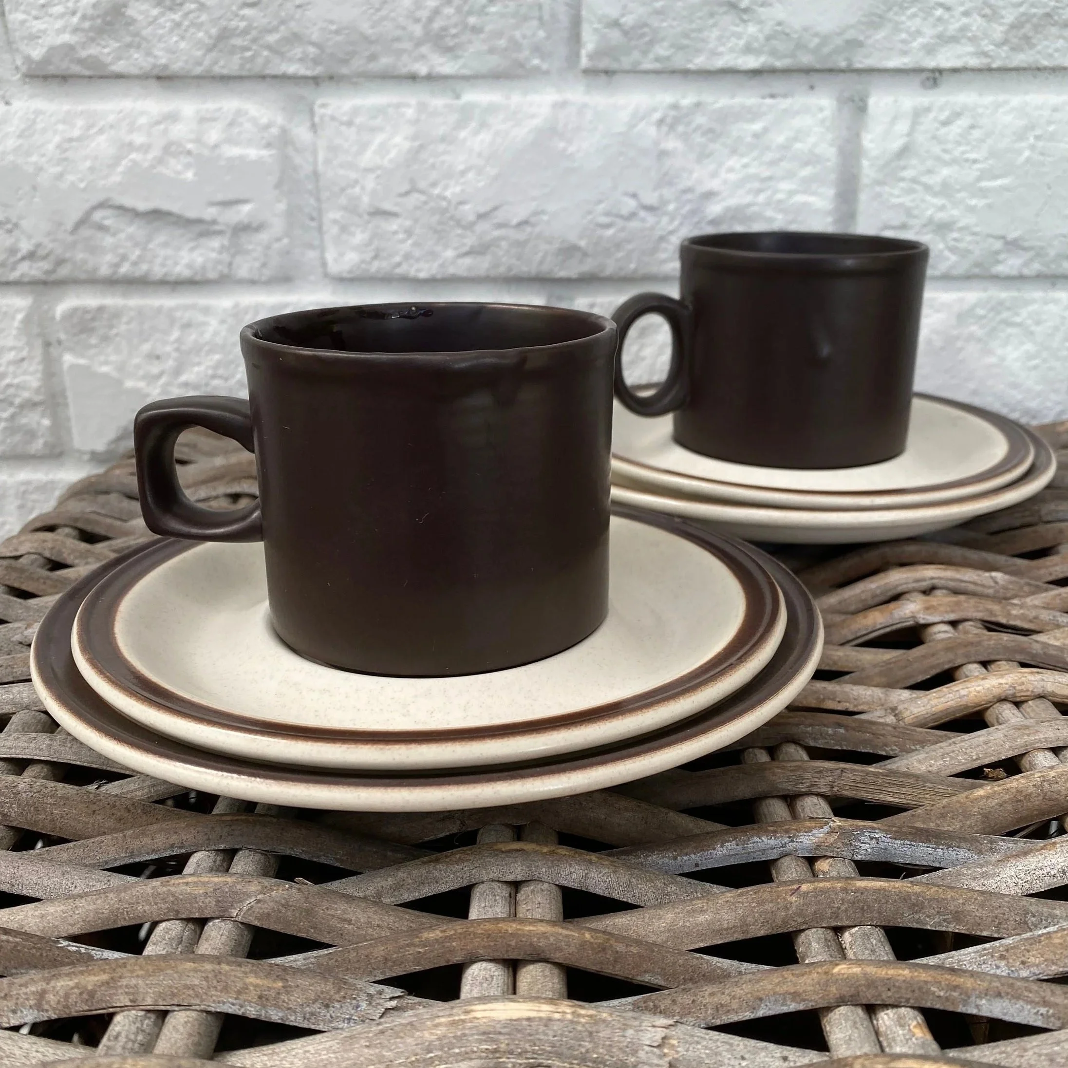 Two Doverstone trio sets displayed together – mugs, saucers, and plates