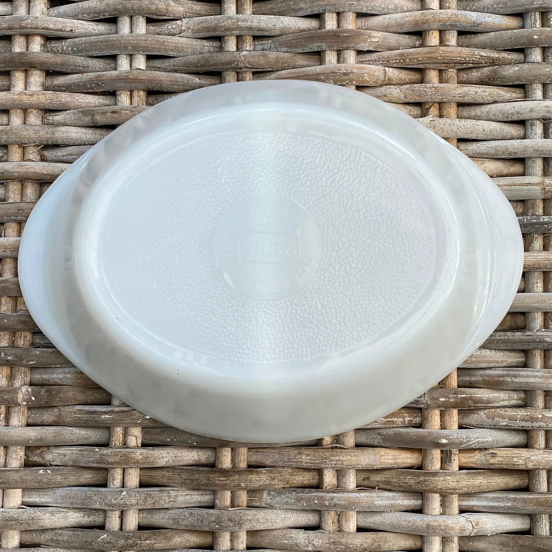 Bottom view showing classic oval shape and textured base