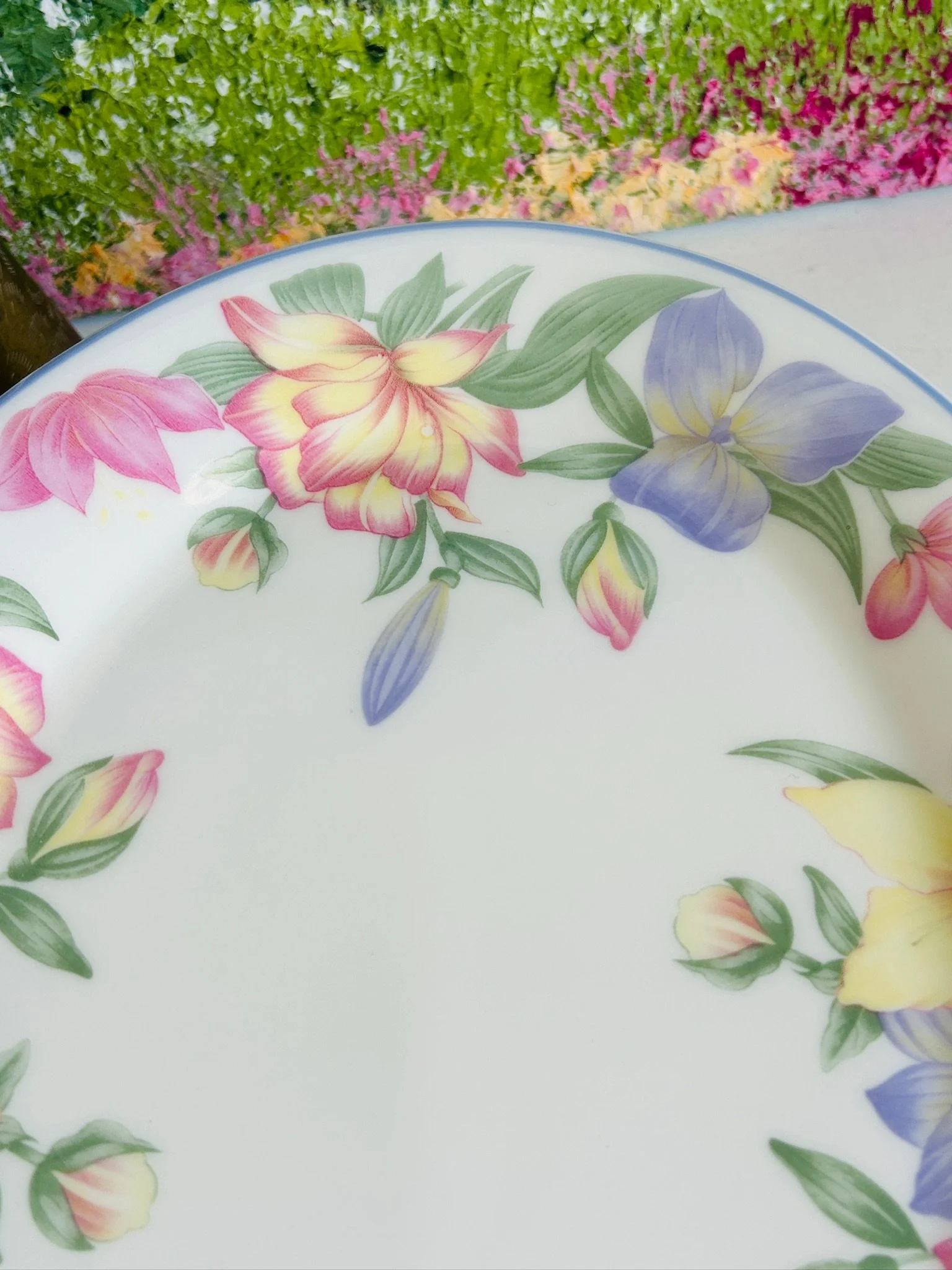 Detailed close-up of the upper floral garland on the Royal Doulton Blooms platter, highlighting the soft pastel flowers and delicate fine china finish