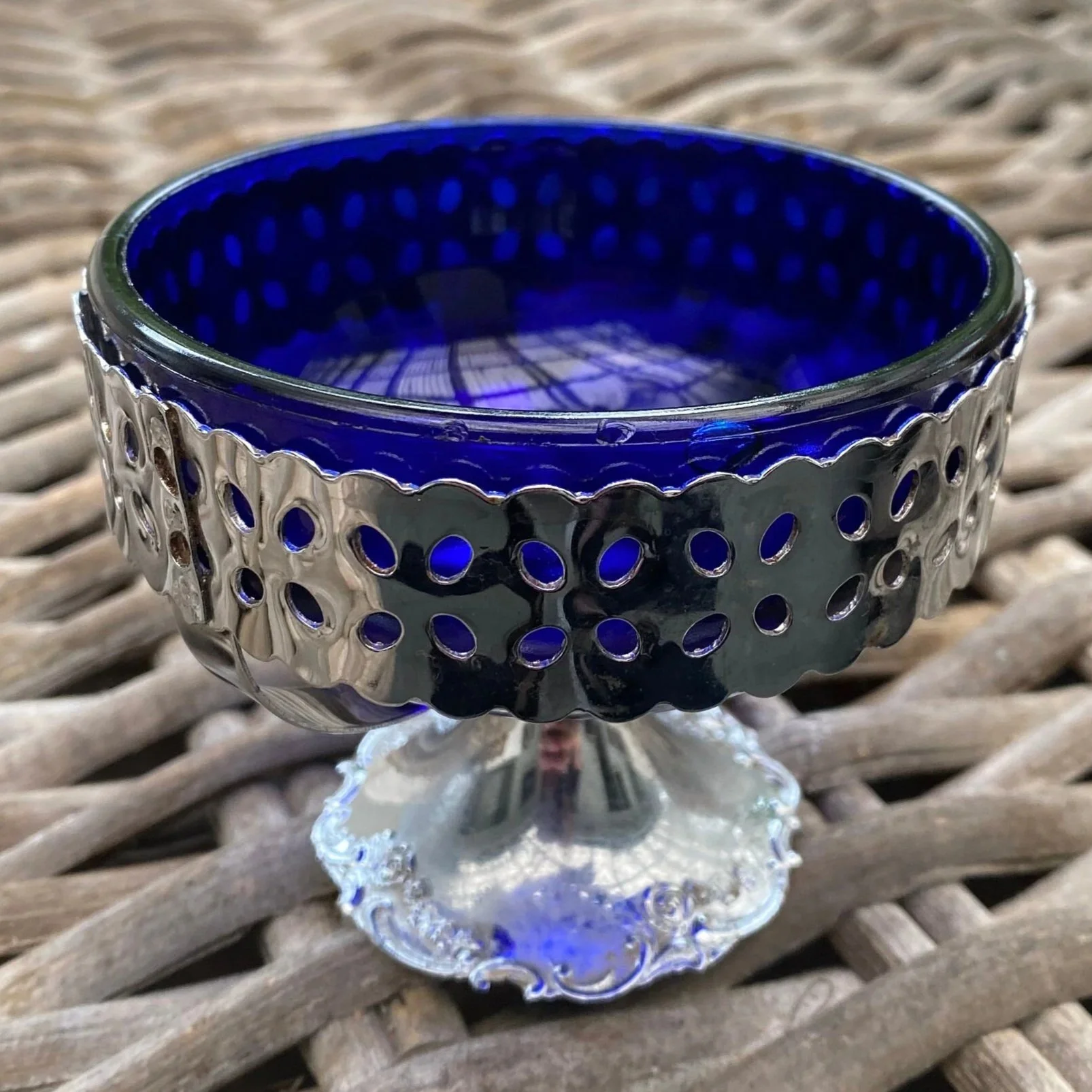 Full front view of cobalt blue sugar bowl in silver-plated pedestal