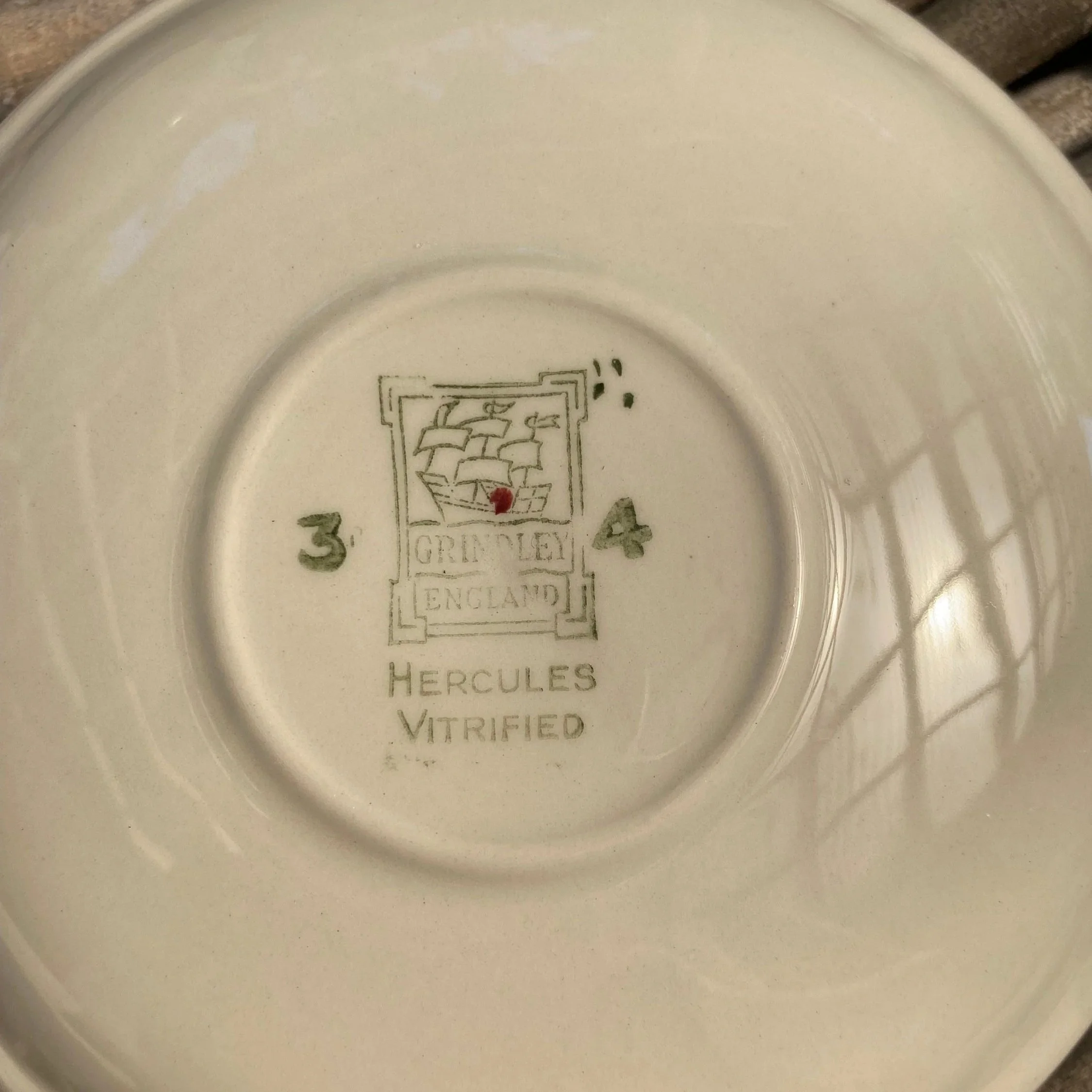 Saucer underside with stamped maker's mark