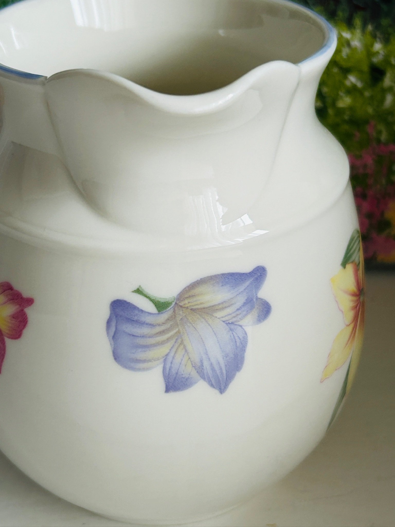 Side close-up of the floral motif wrapping around the body