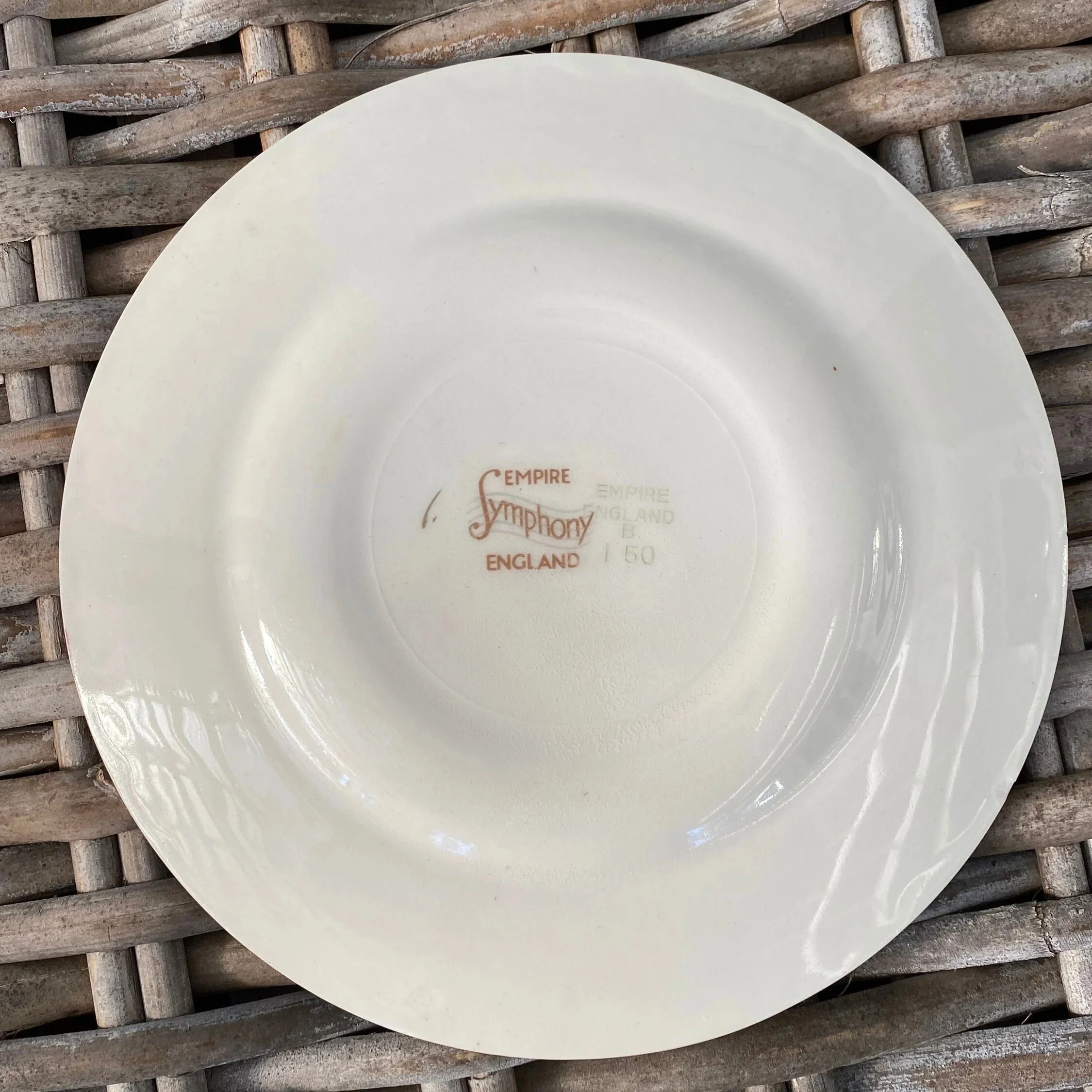 Plate backstamp with visible number 553 and light wear