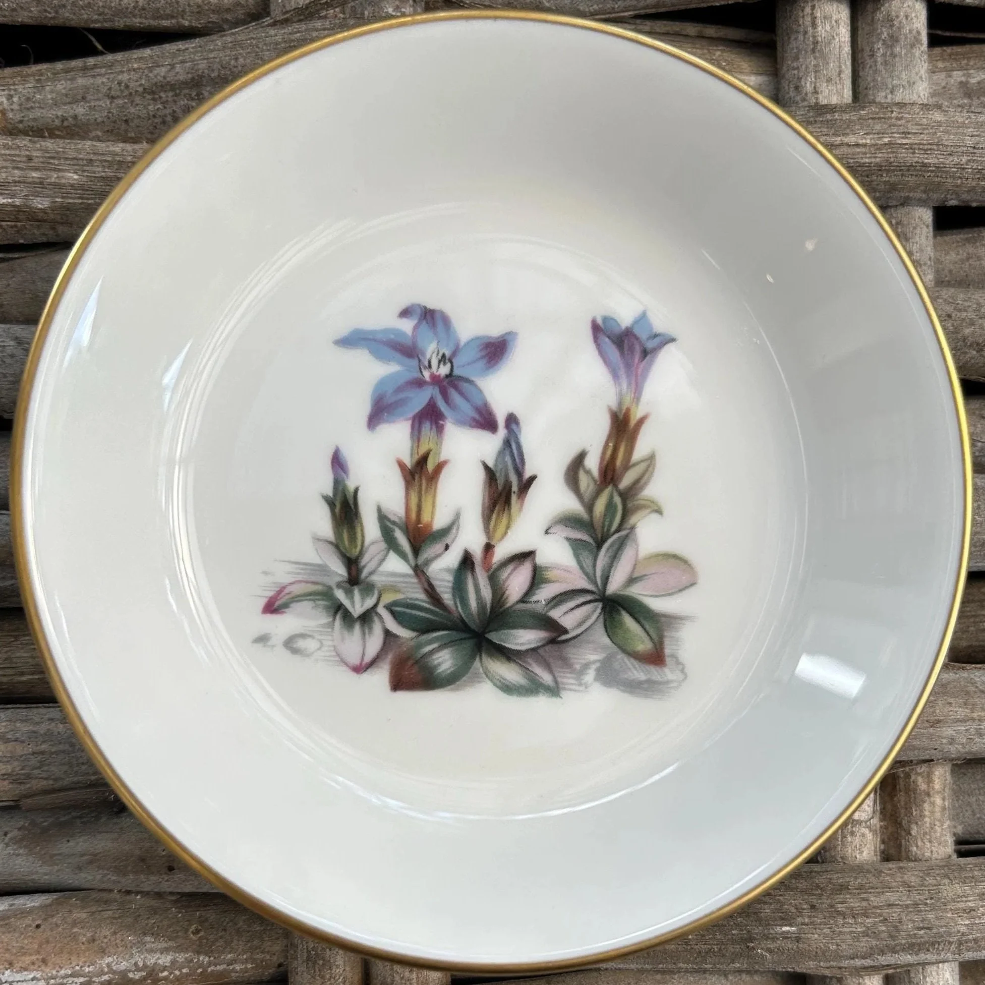 Blue flower dish with detailed floral design and gold edge