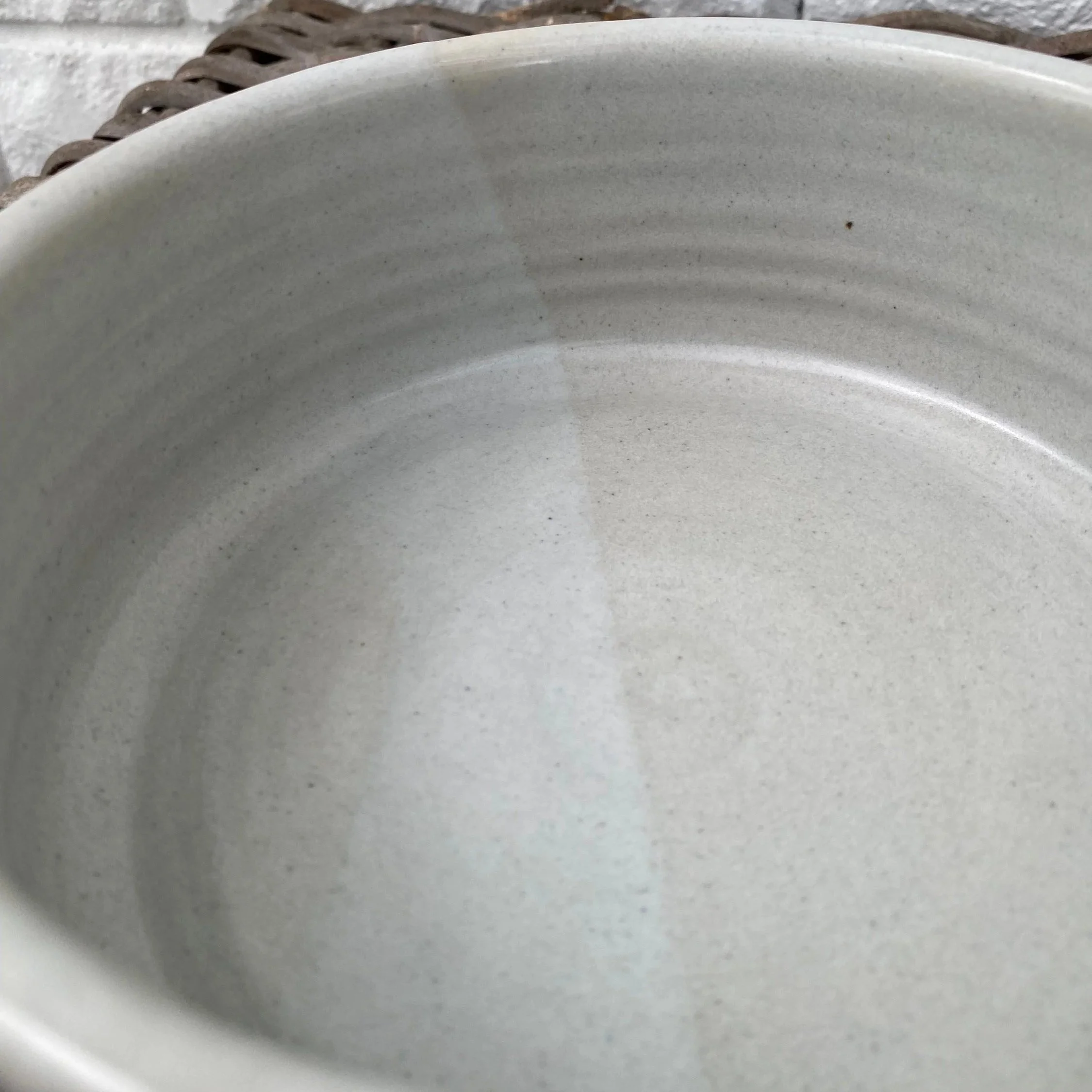 Interior view of bowl with soft grey glaze