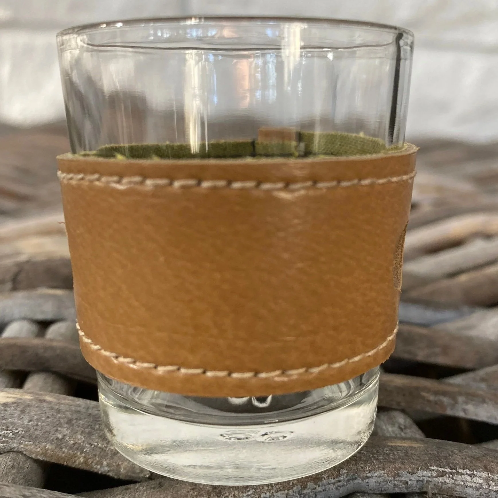 Tan leather band with smooth grain and white stitching