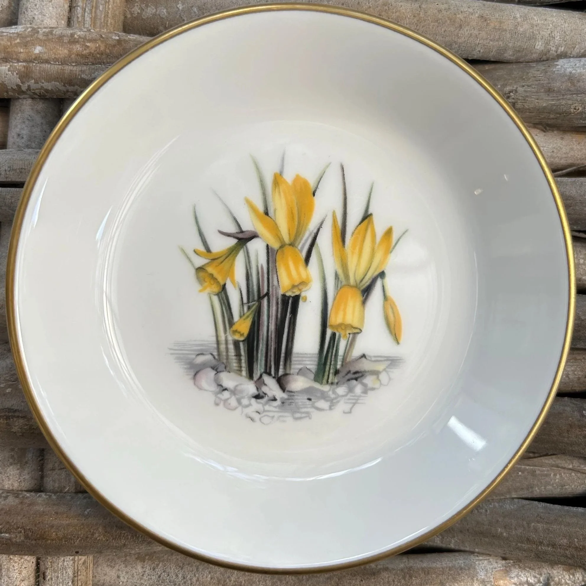Yellow flower dish with upright floral motif and glossy finish