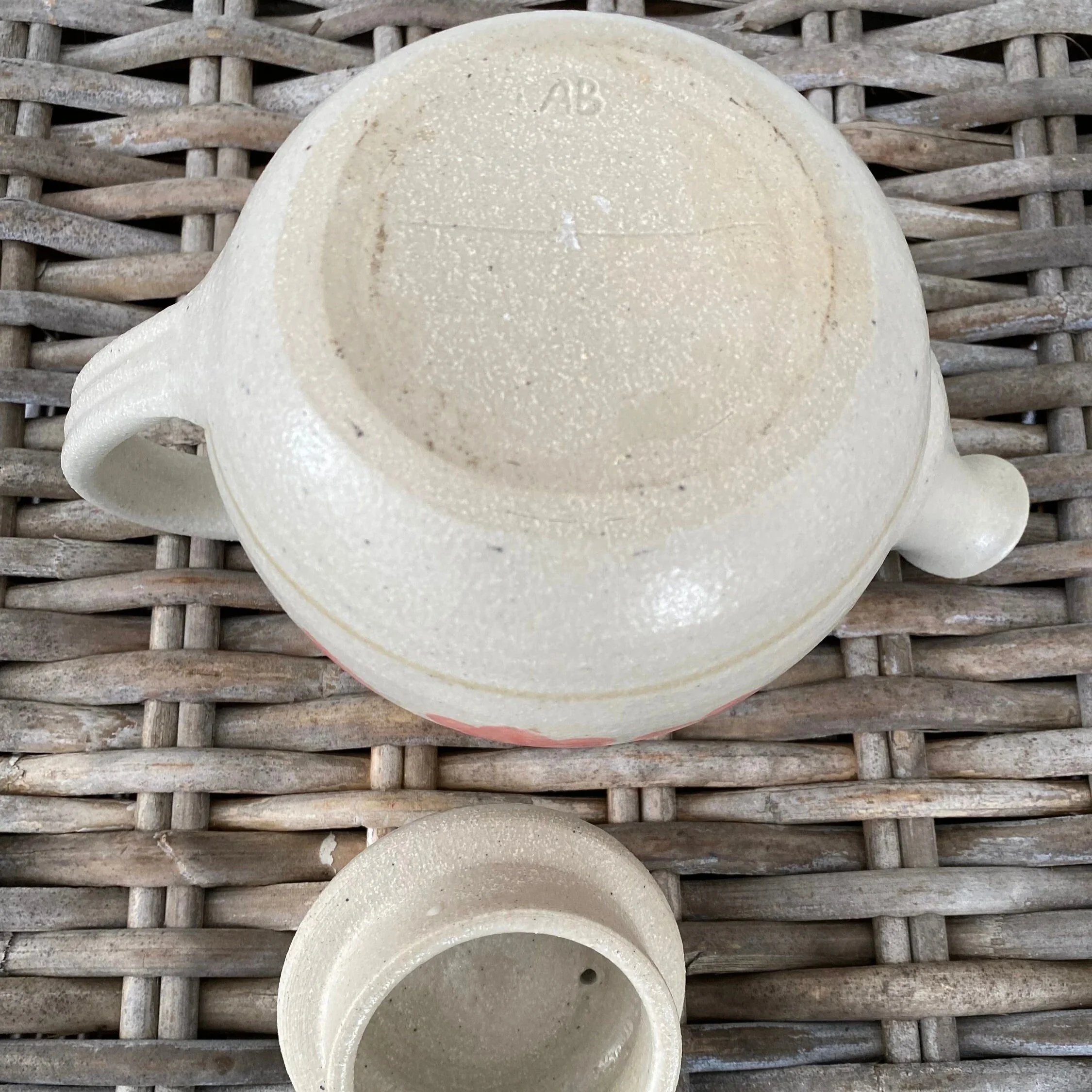 Base of the teapot displaying “AB” maker’s mark