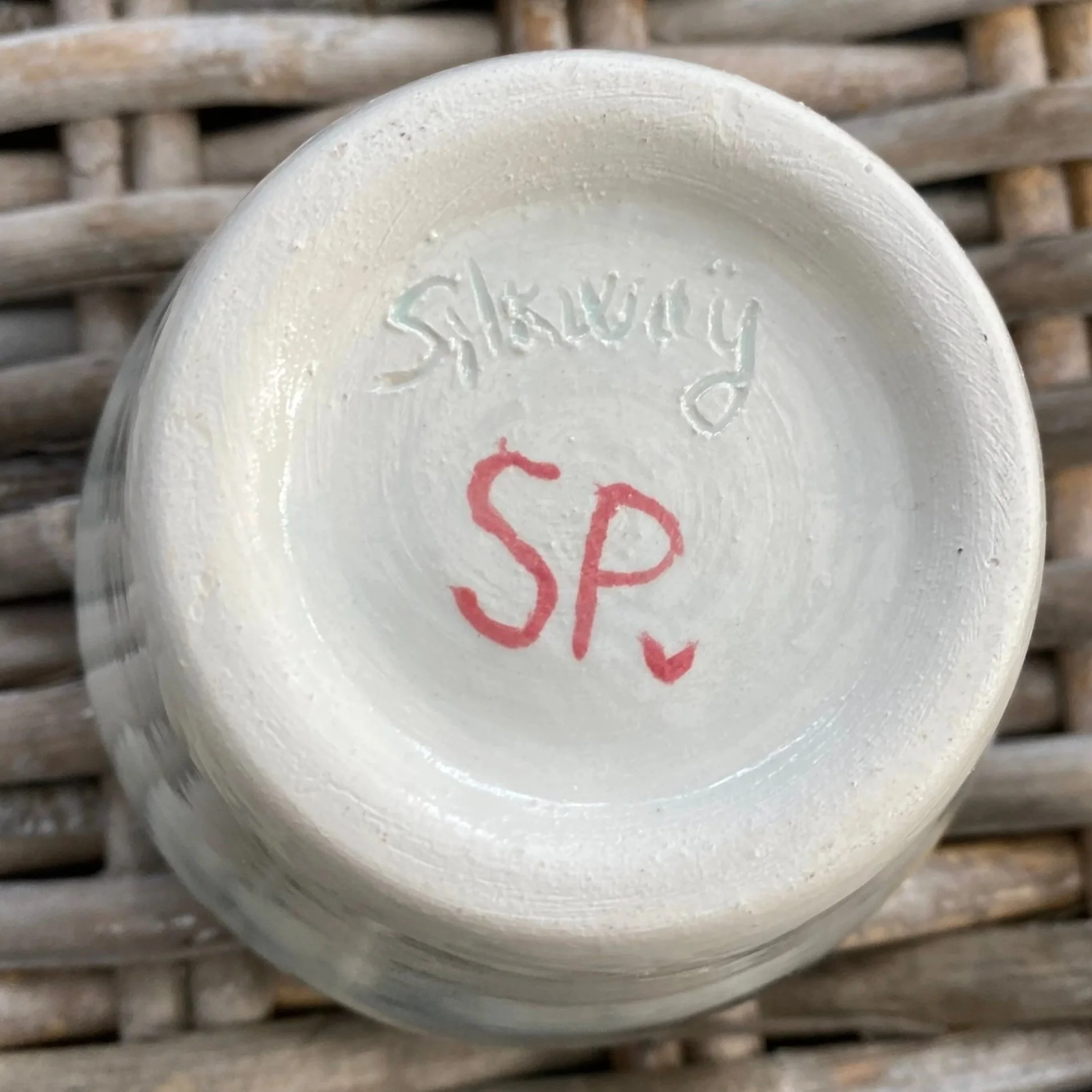 Underside showing “Silkway SP” signature with red initials
