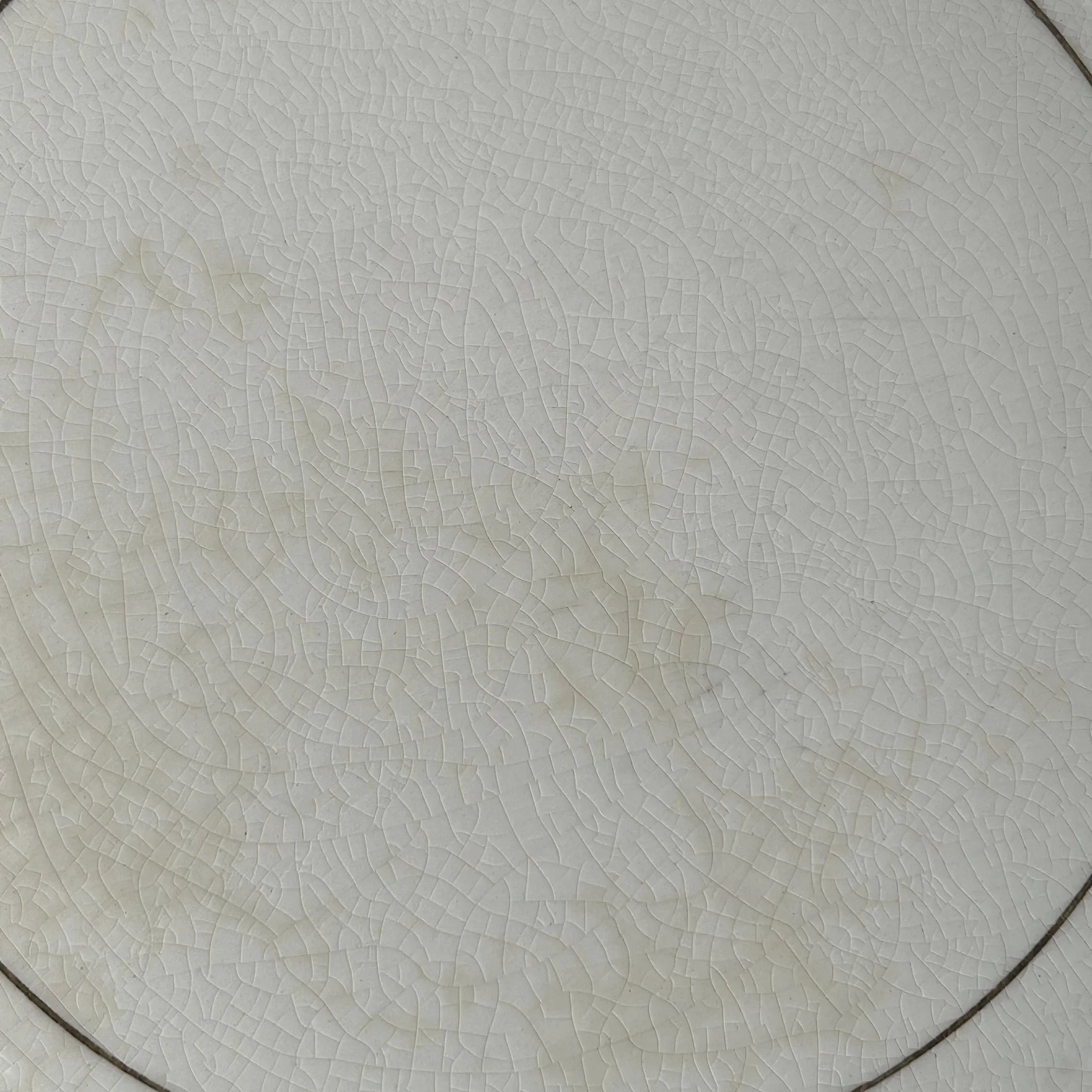 Centre surface of plate showing aged crazing and gentle staining
