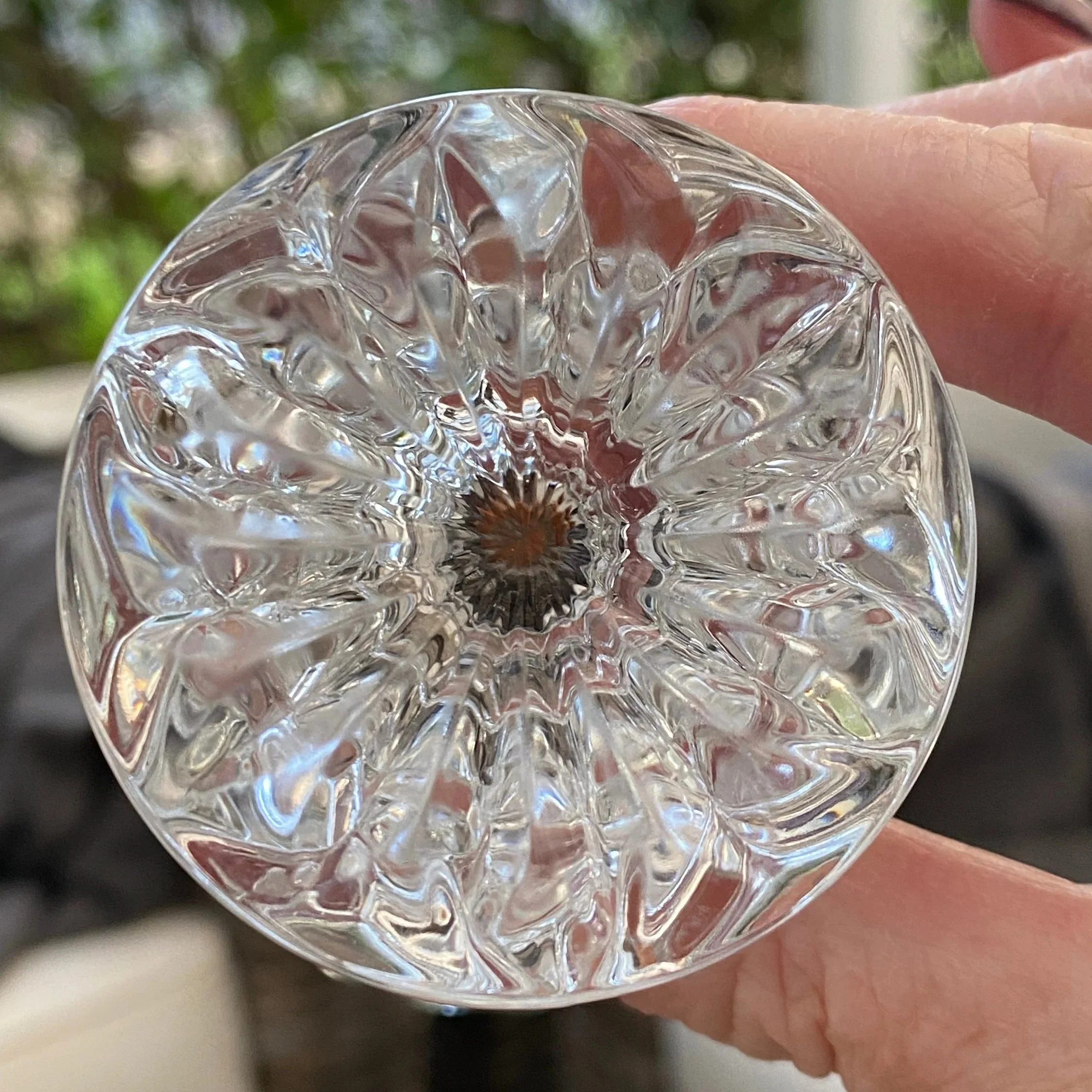 Base view of the vase showing the starburst-style cut pattern in the clear crystal