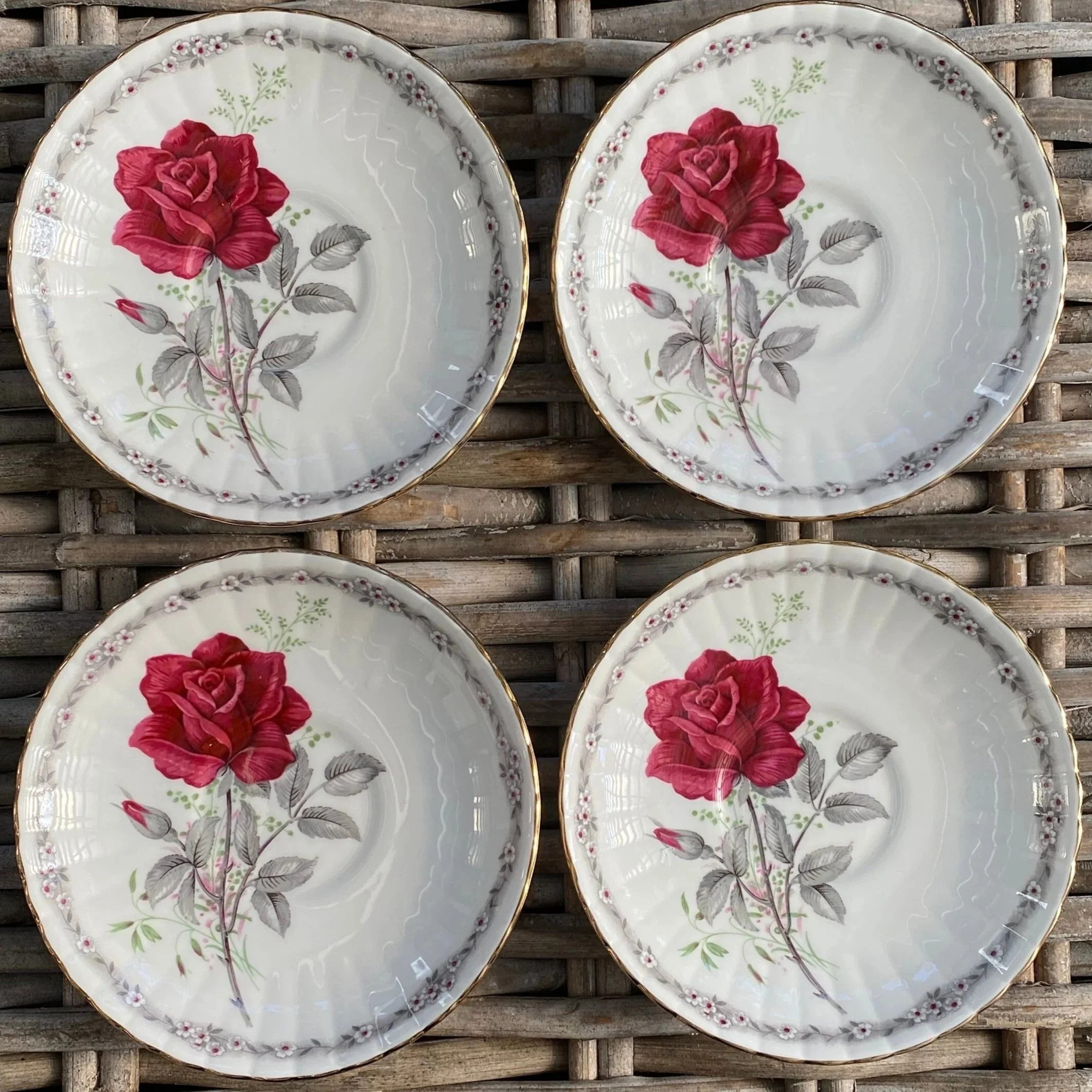 Full view of saucers showing floral pattern and placement