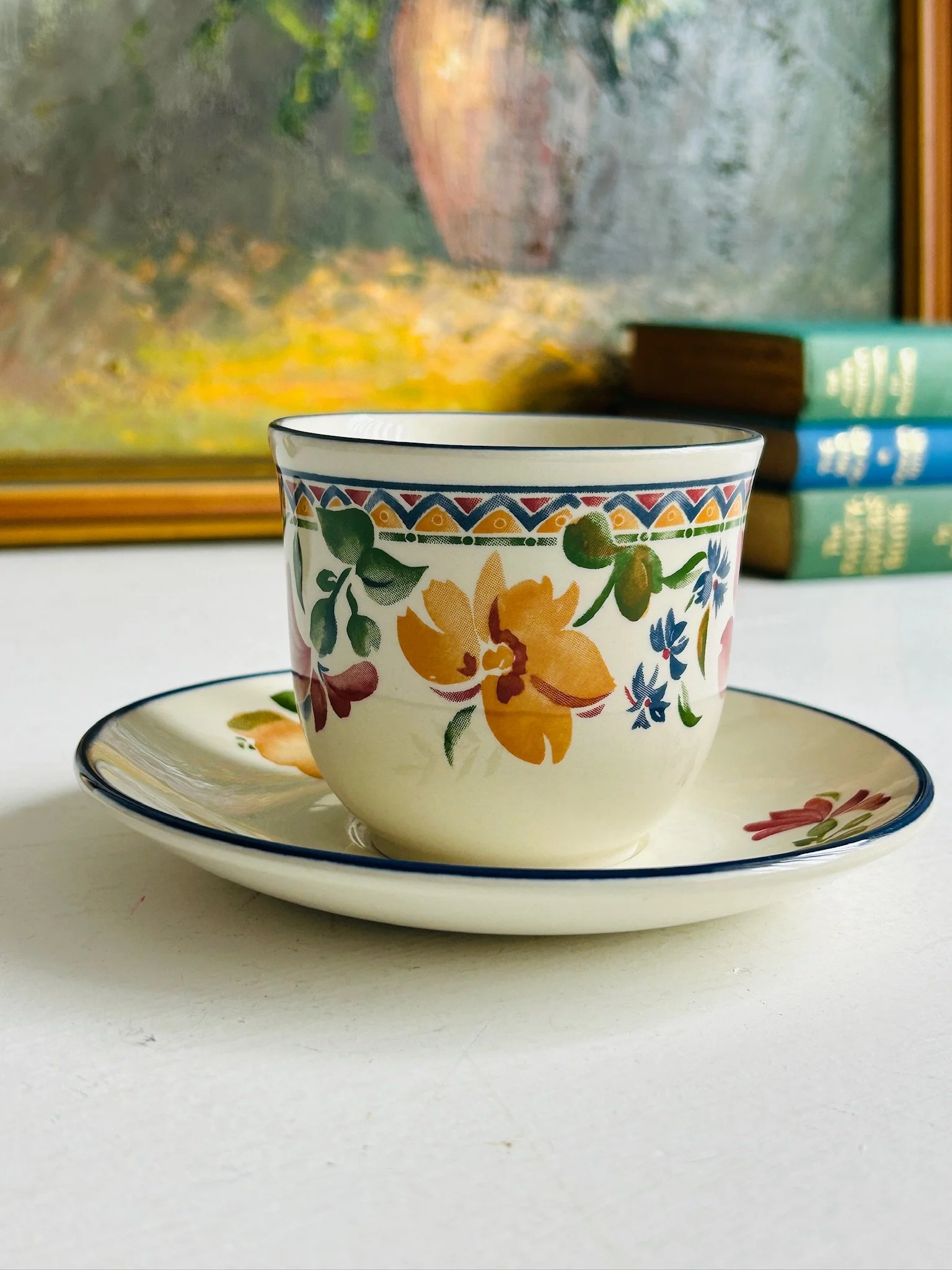 Reverse side of the Staffordshire ‘Calypso’ tea cup and saucer set, showing the yellow floral motif on the cup and the matching saucer design.