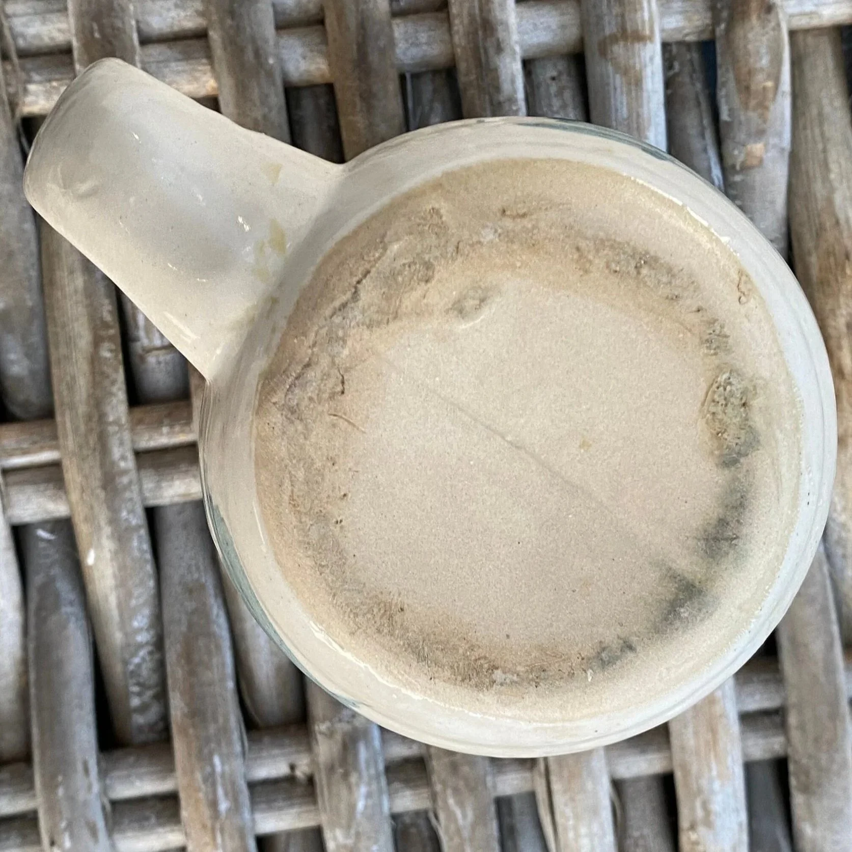 Underside view of mug showing unglazed base