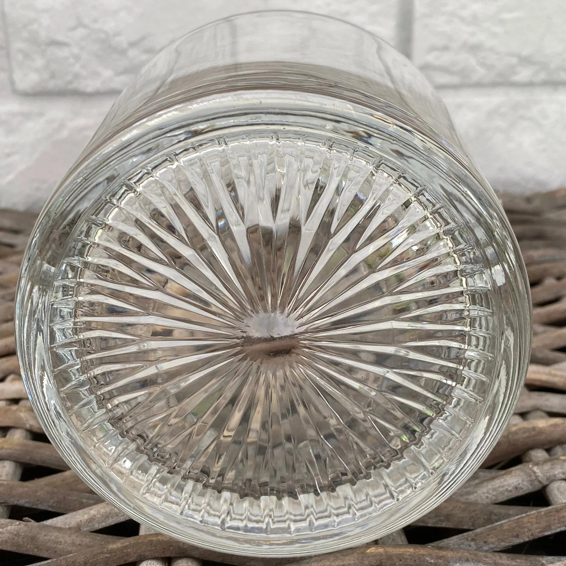 Bottom of bucket displaying starburst pressed glass pattern