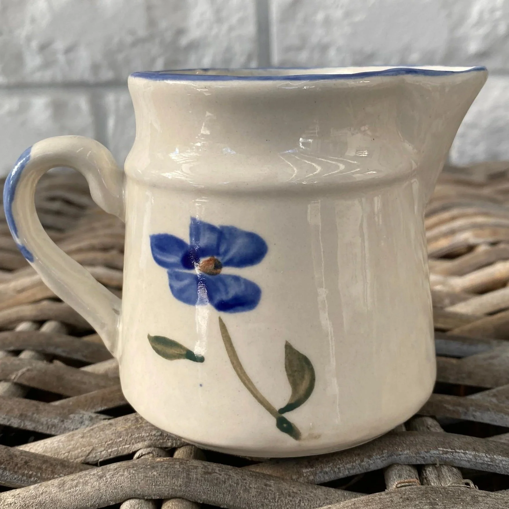 Milk jug with hand-painted floral detail and soft rim flare