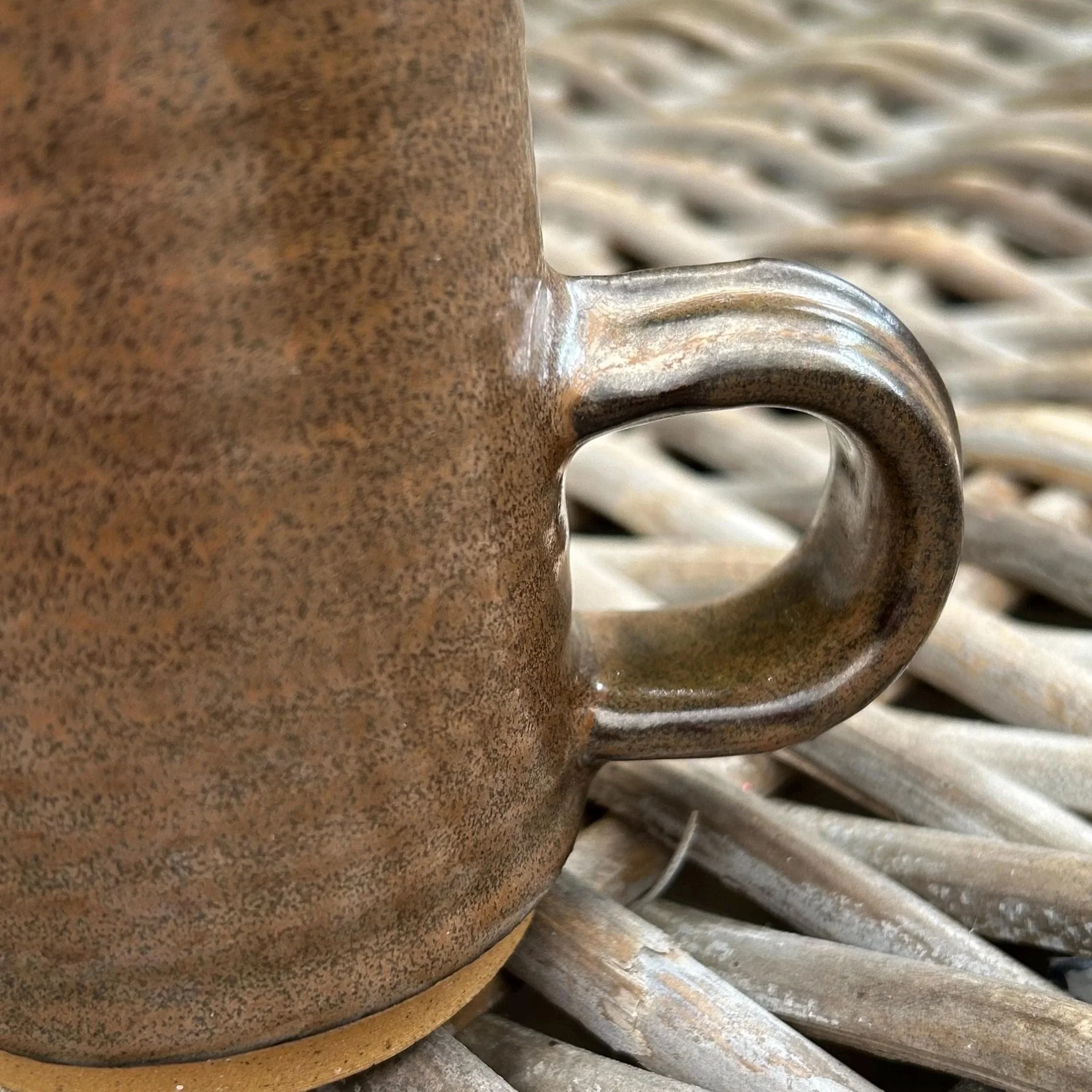 Close-up of handle join and glaze variation along body