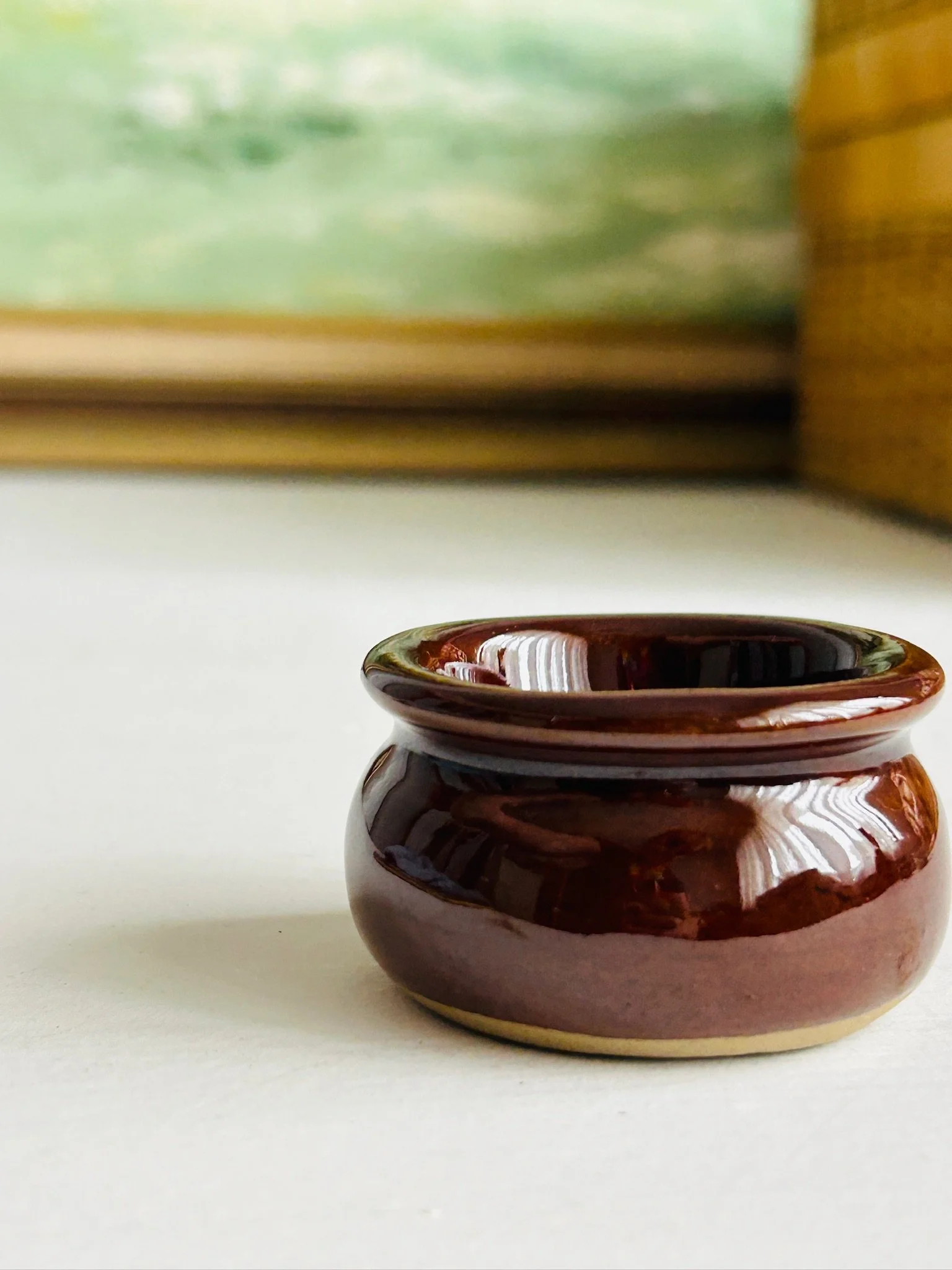 Front view of the handcrafted English salt cellar against a simple interior background