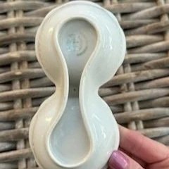 Underside view highlighting base and sculptural curves