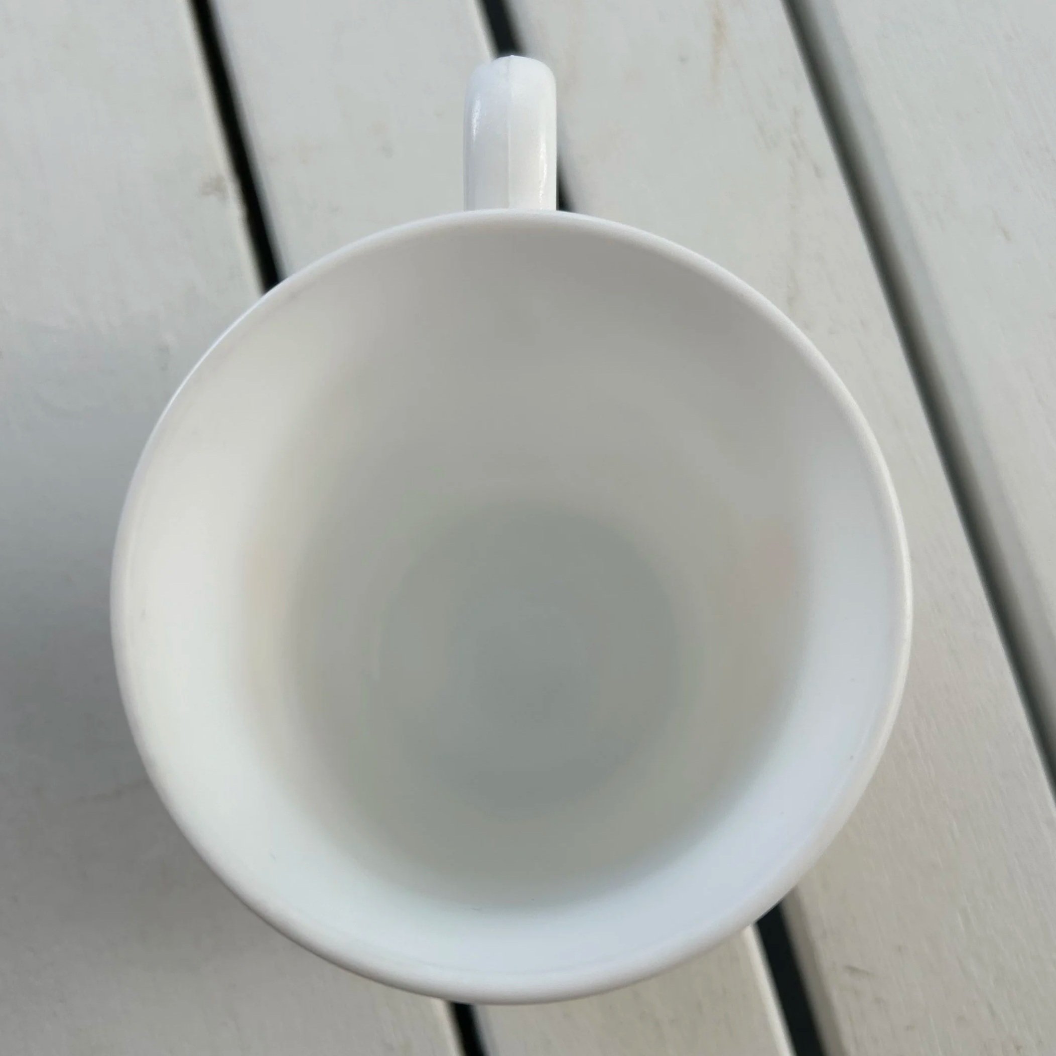 Overhead view of clean white interior and flared rim