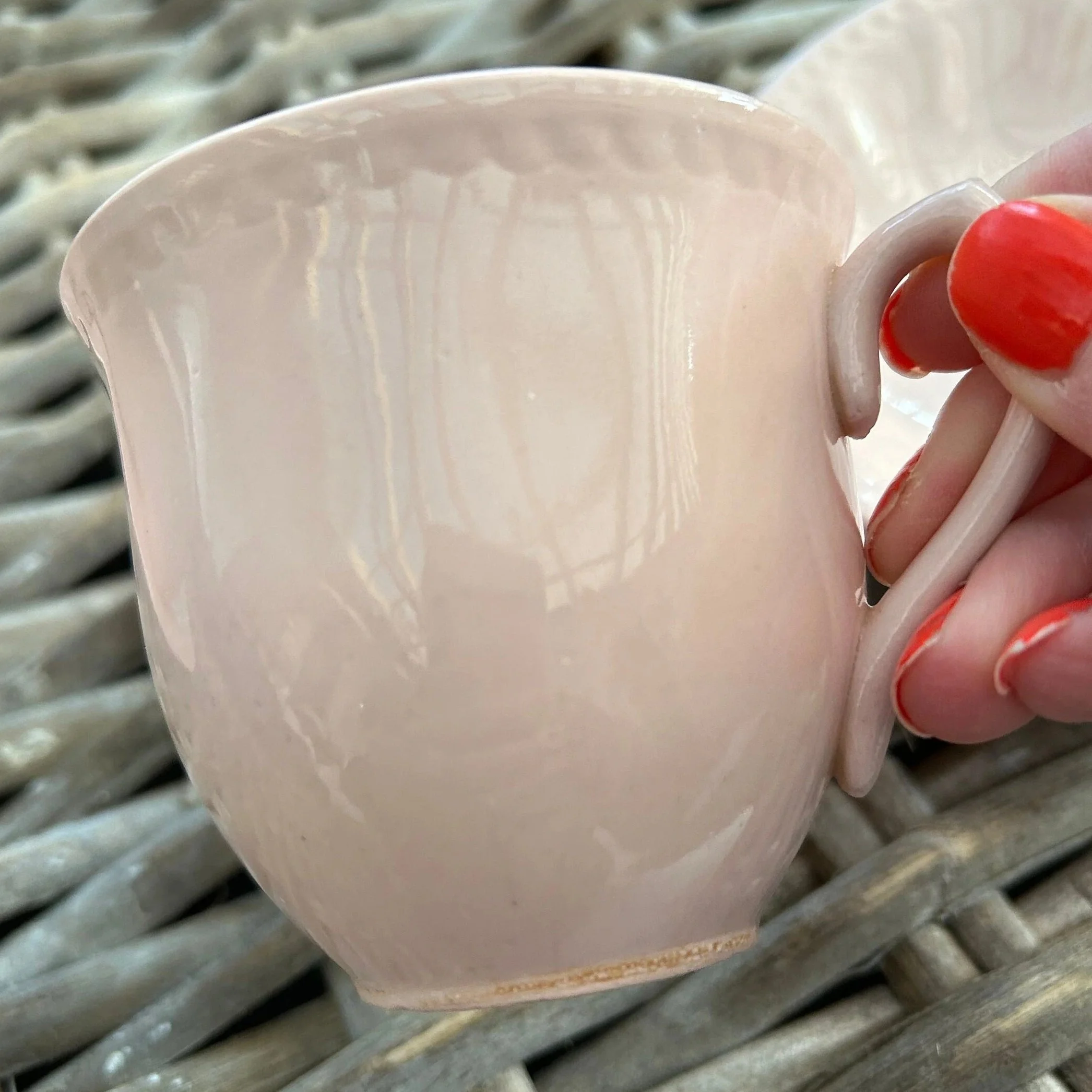 Detail shot of the soft pink glaze and swirl embossing
