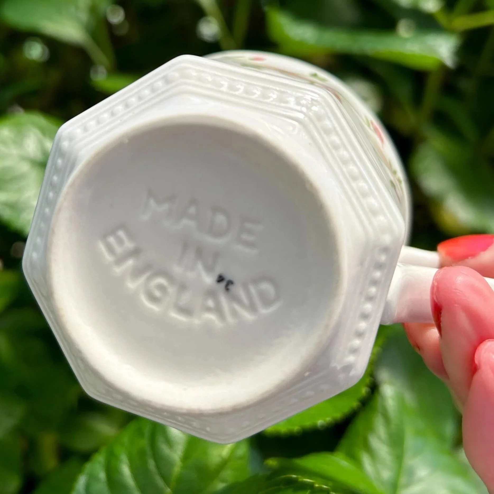 Underside of cup with “Made in England” stamp visible