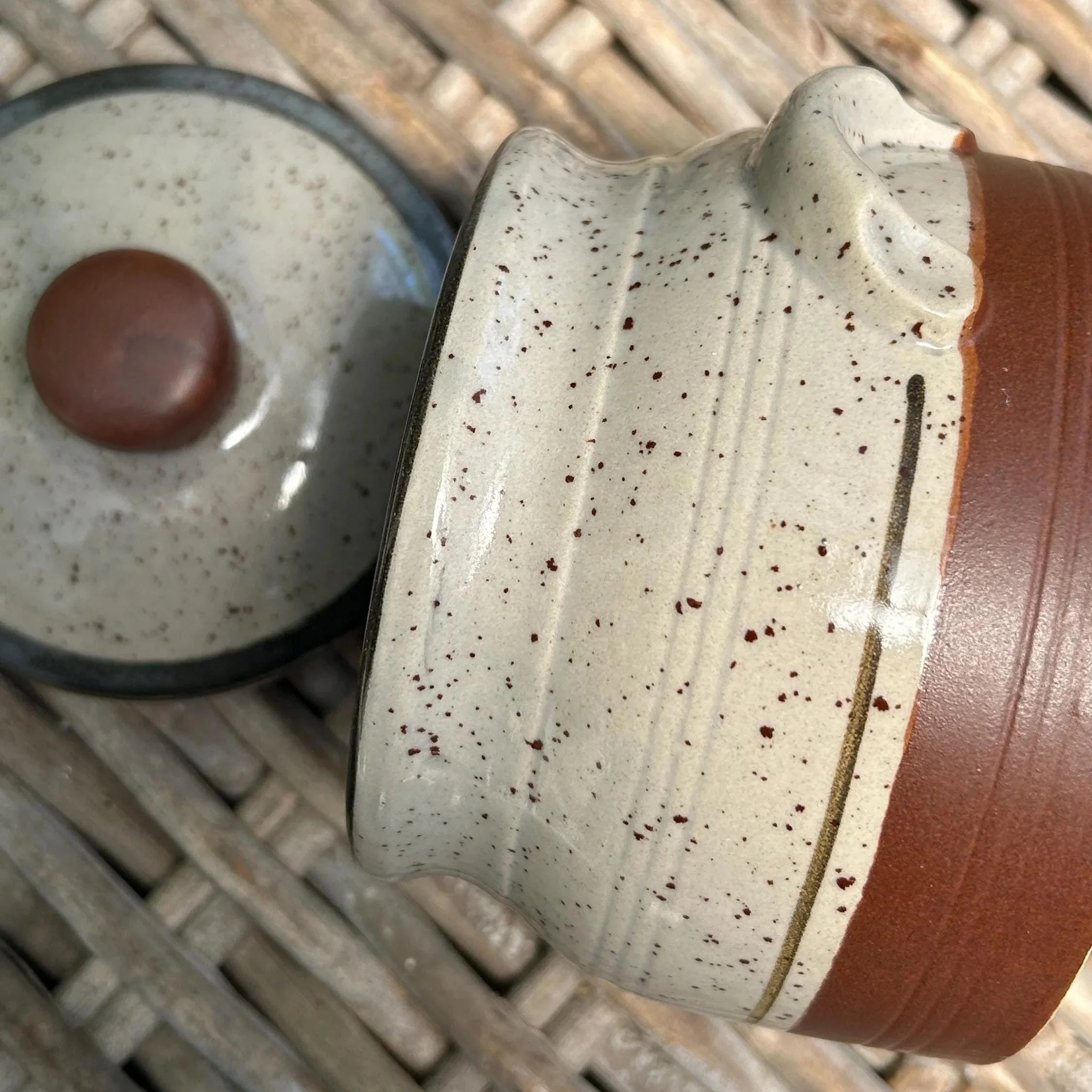 Side angle of pot showing textured glaze and handle detail