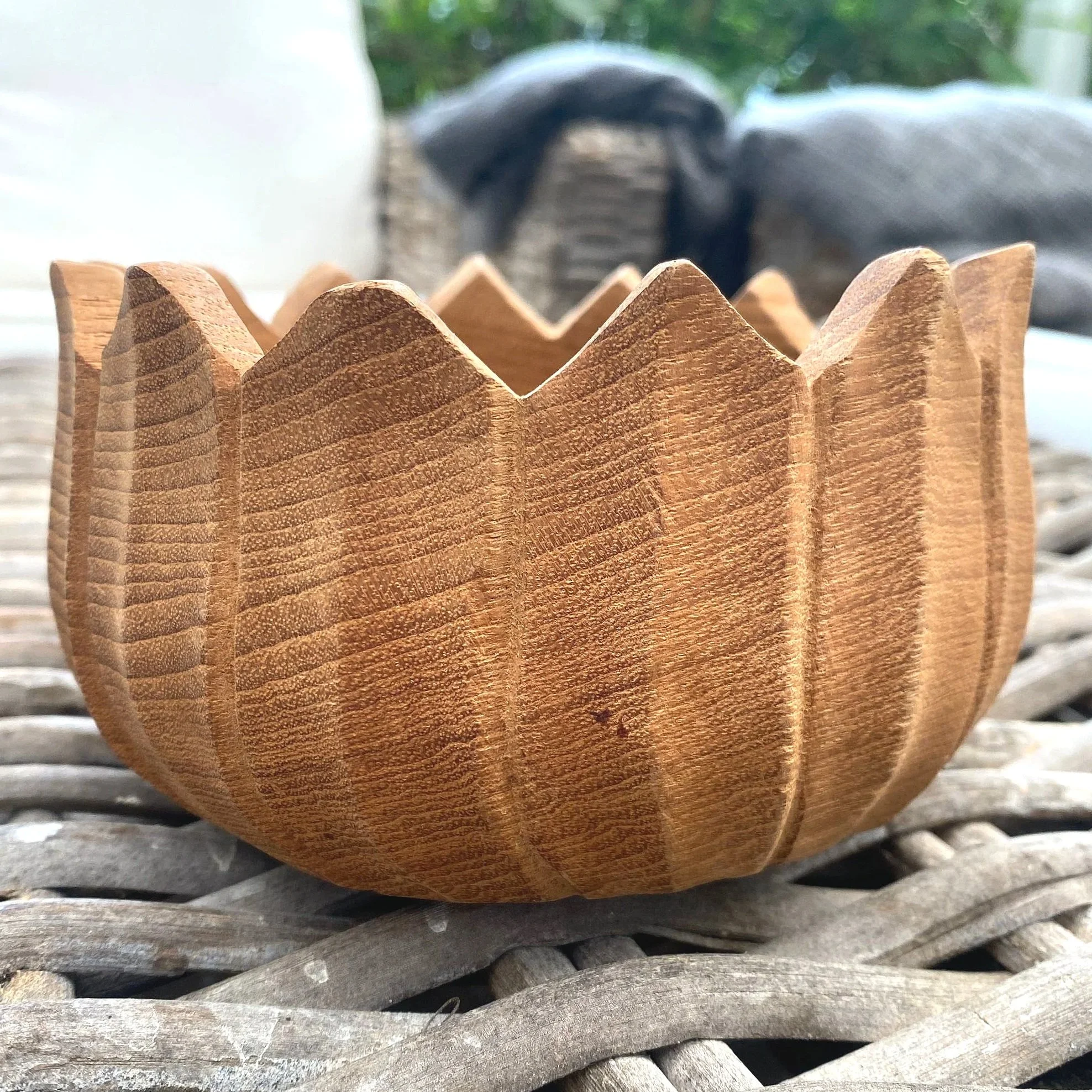 Side angle showing height and sculptural detailing of bowl