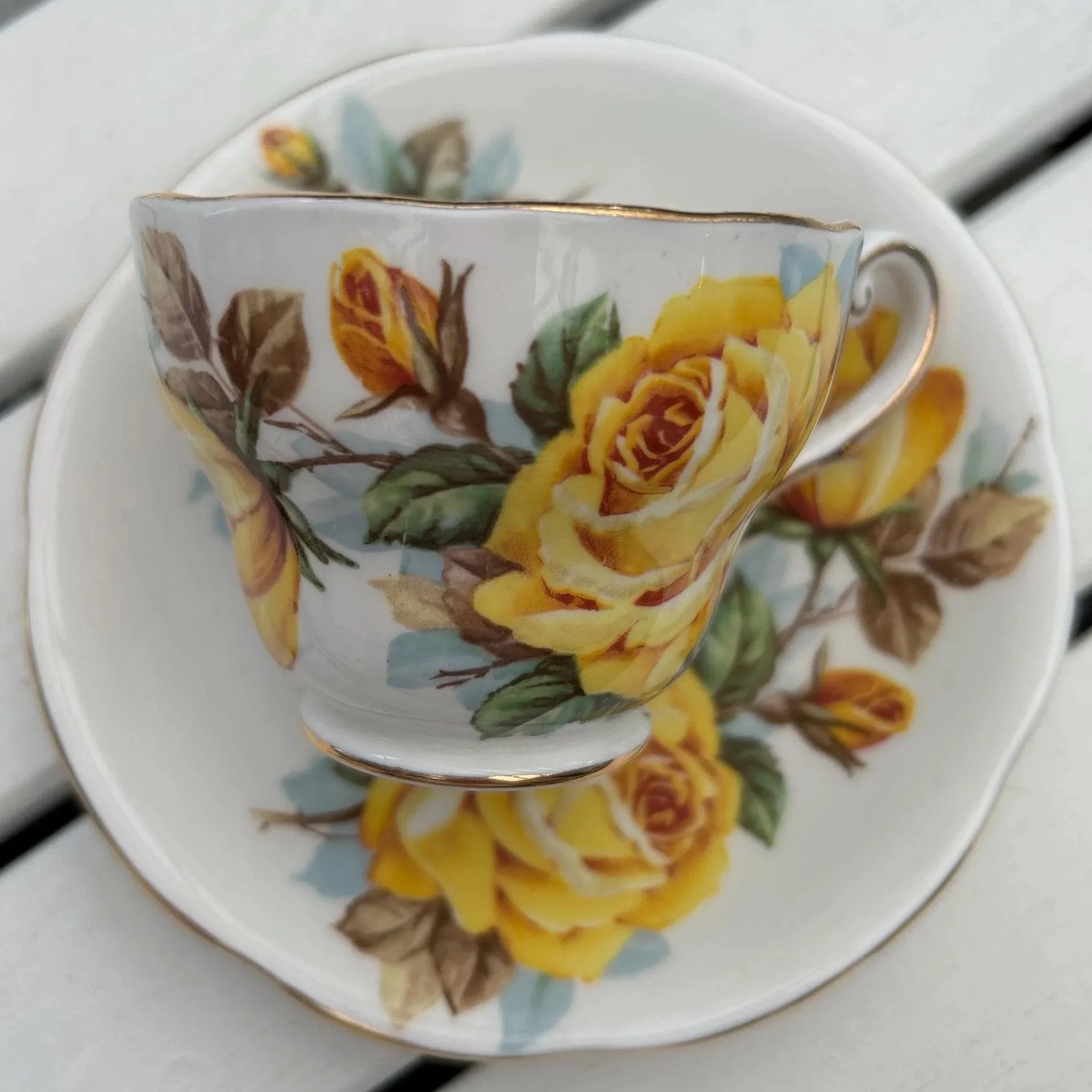 Cup stacked inside saucer with full rose transfer visible