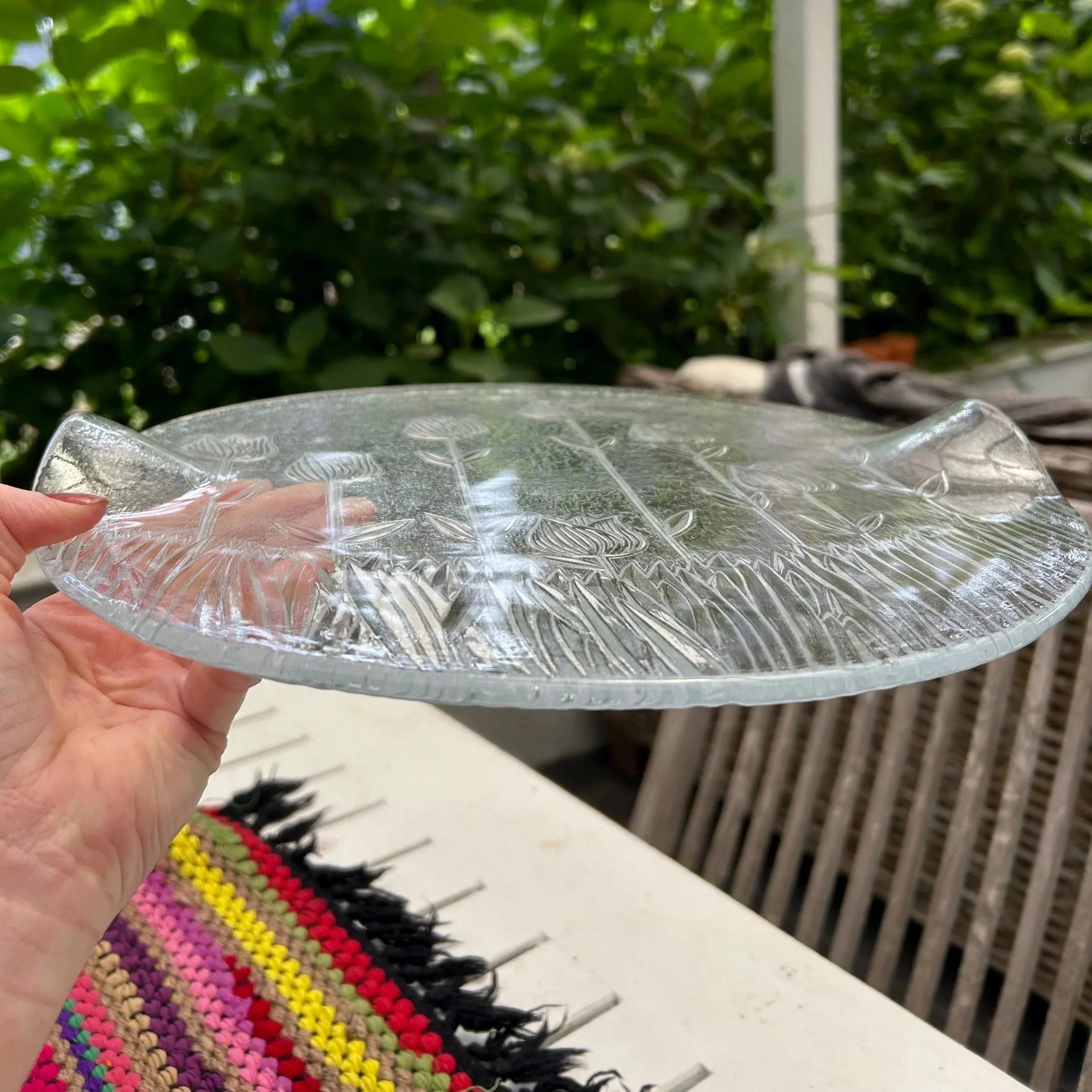 Side profile showing thickness and subtle curved rim of mouth-blown platter.