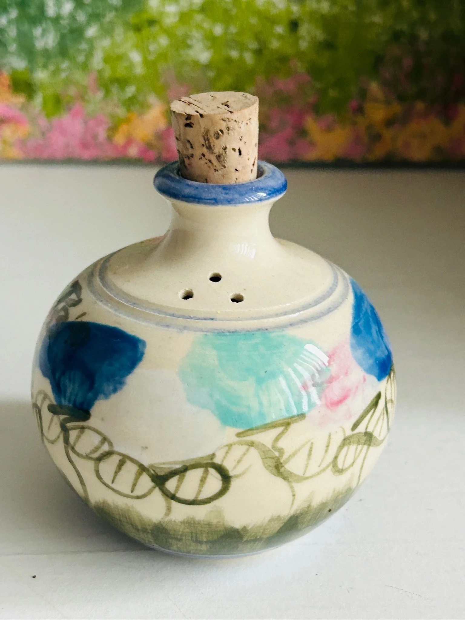 Close-up angled view of the upper neck, blue rim, and cork stopper on vintage Australian pottery shaker