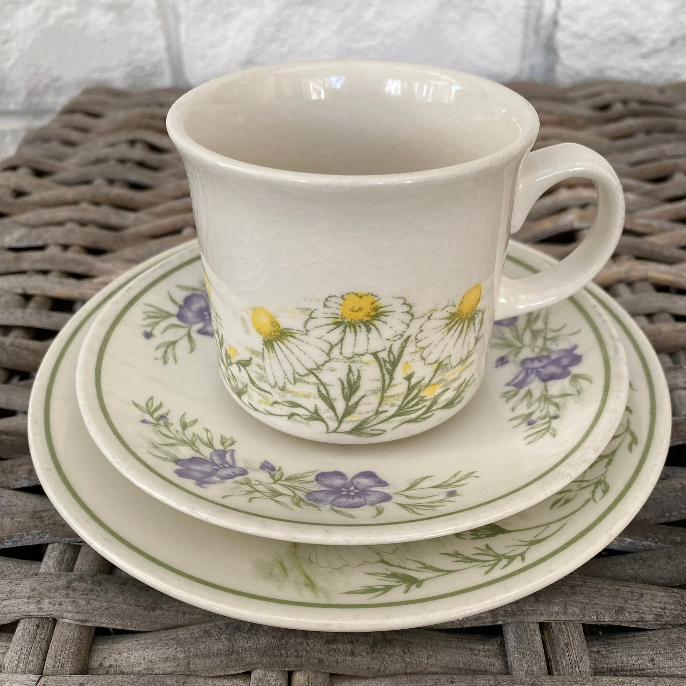 Churchill England floral trio tea set featuring yellow daisies and purple herbs on white ceramic