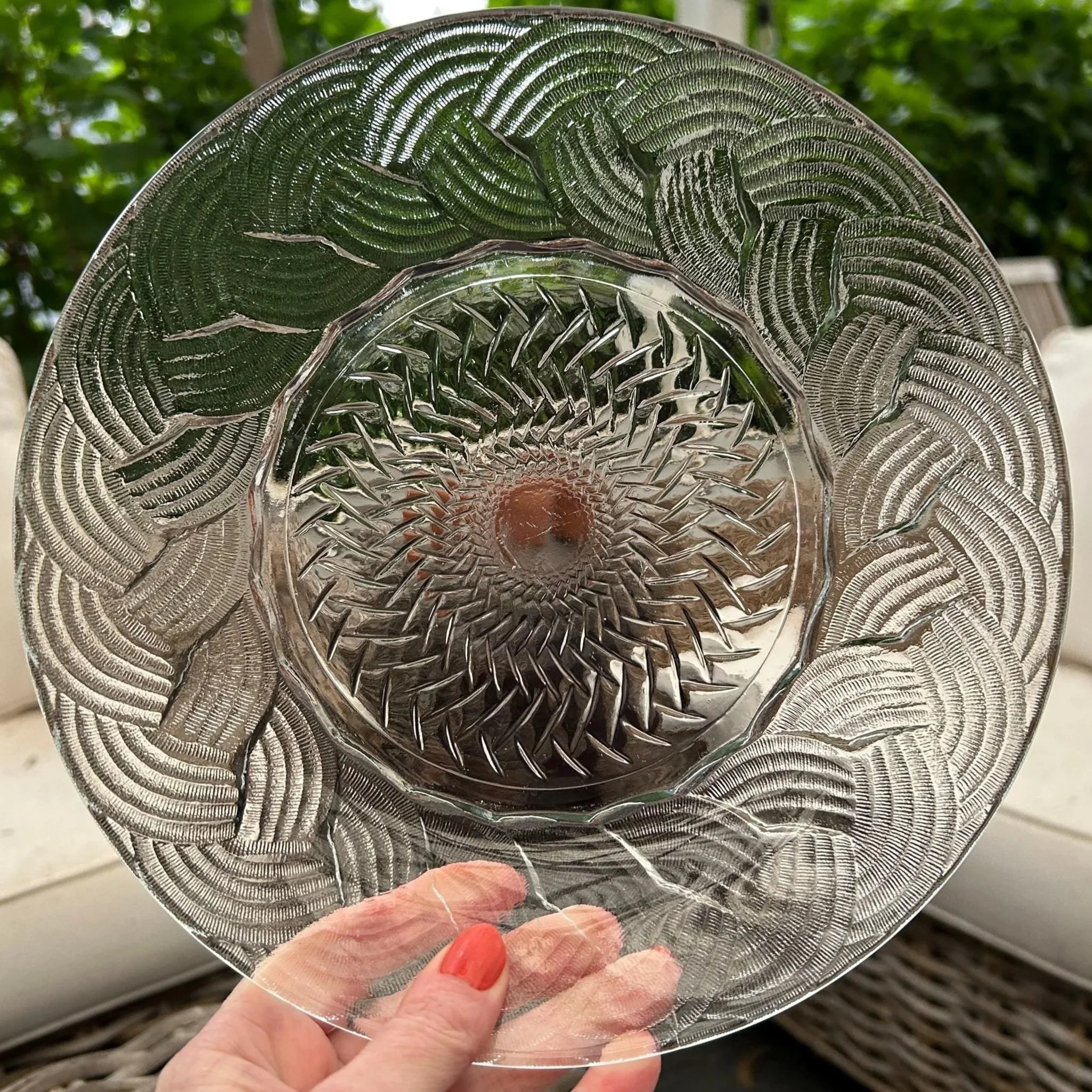 Single bowl held upright showing full braided rim design