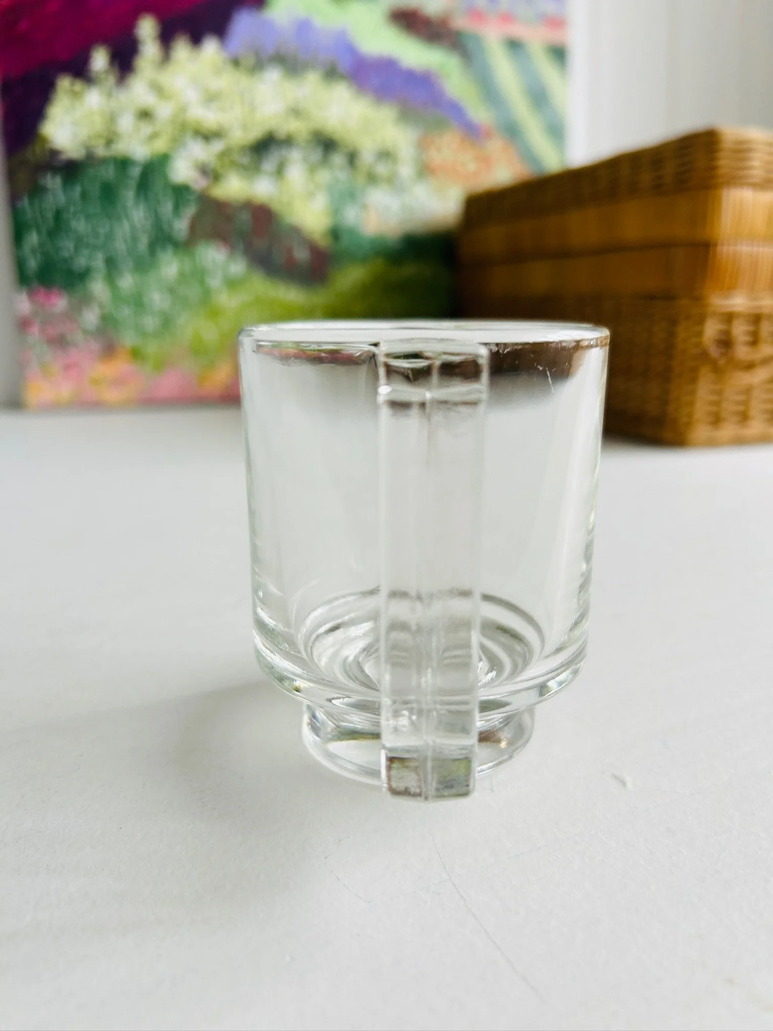 Rear view of the Joe Colombo Arno creamer highlighting the clear angular handle and cylindrical body