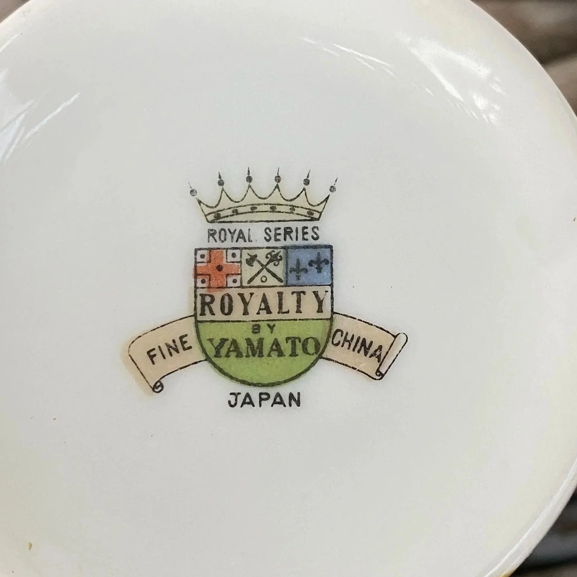 Underside close-up showing “RC Royalty Series Yamato Fine China” stamp