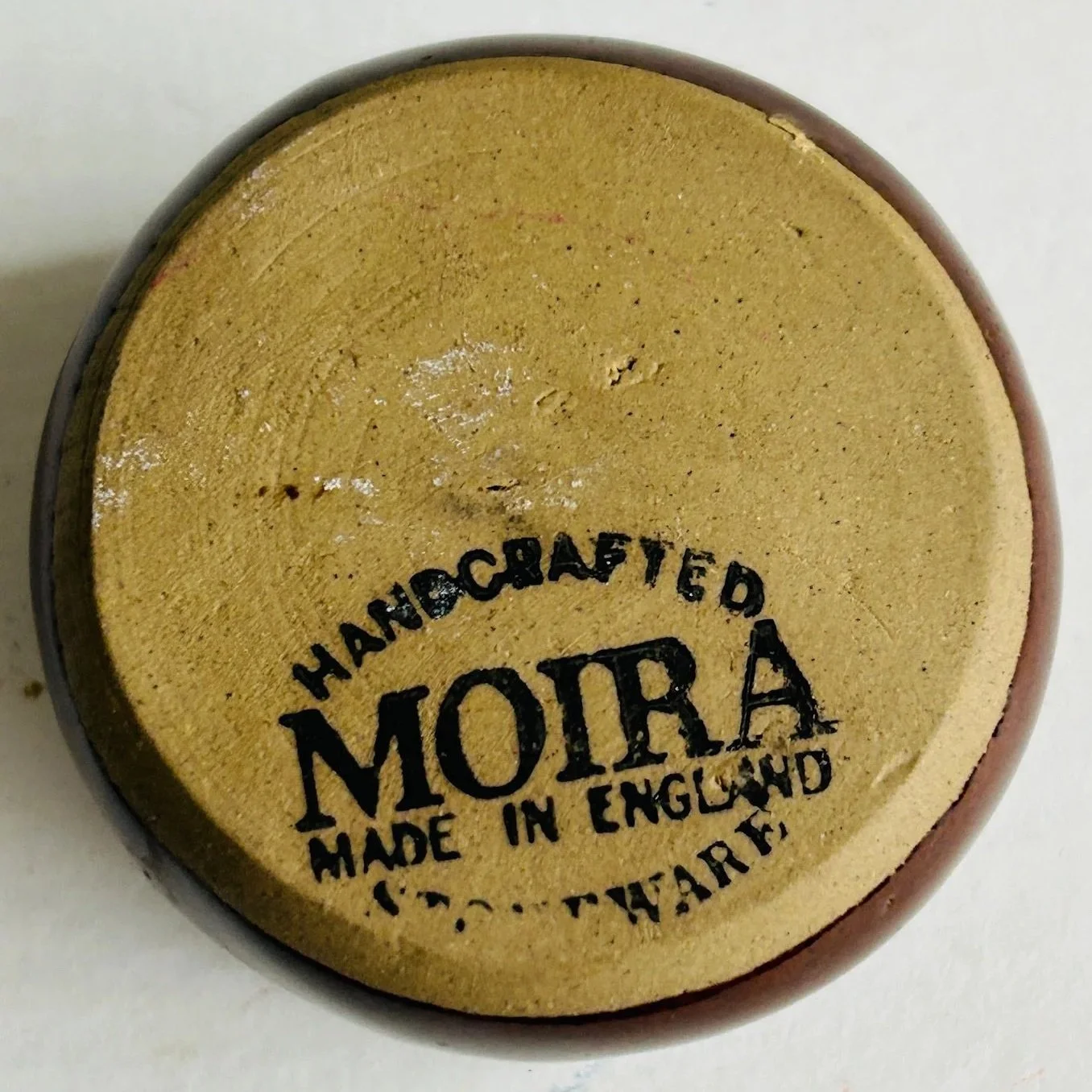 Underside of the salt cellar showing the stamped maker’s mark reading “Handcrafted Moira Made in England”