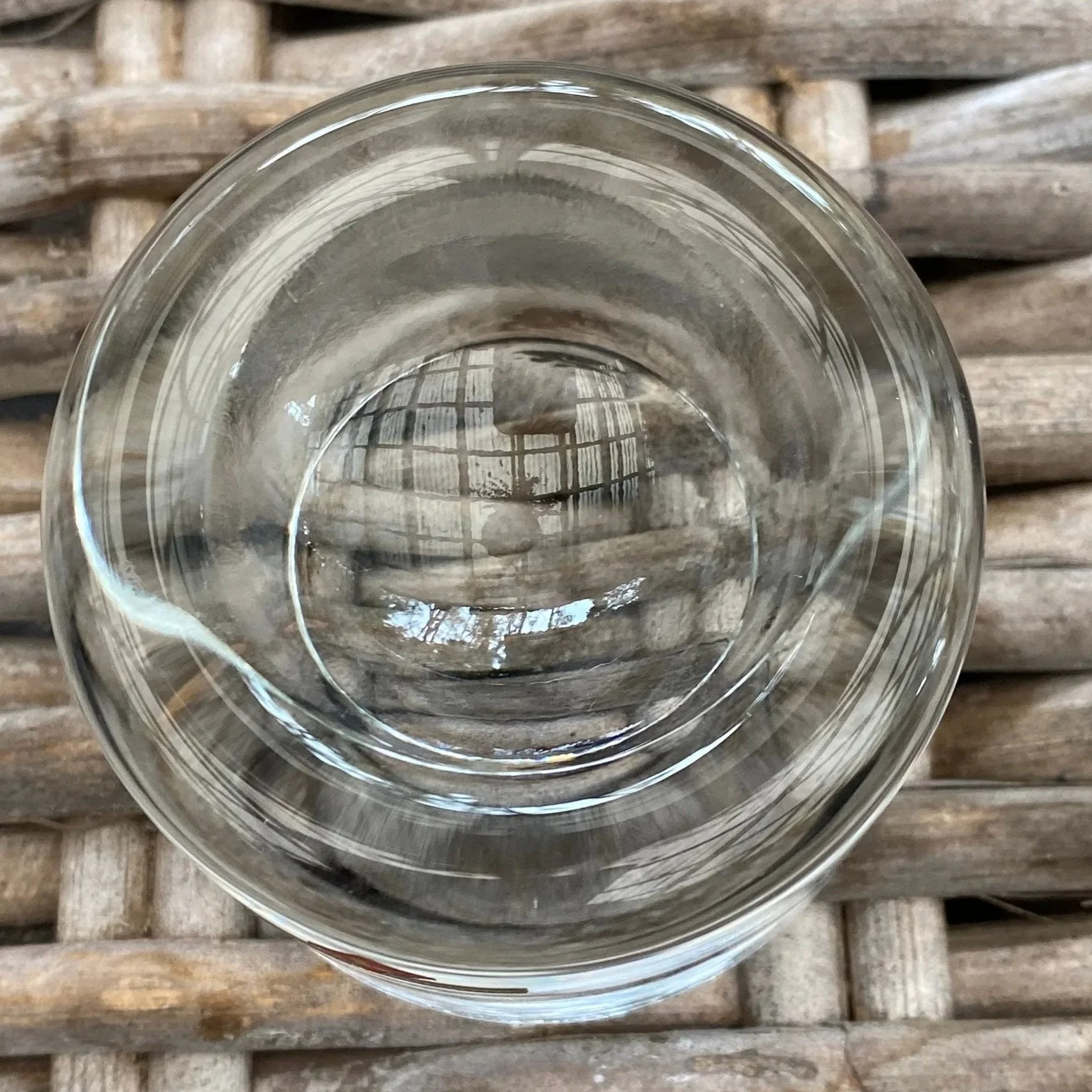 Top view of the tea light holder showing the circular candle recess in the thick glass