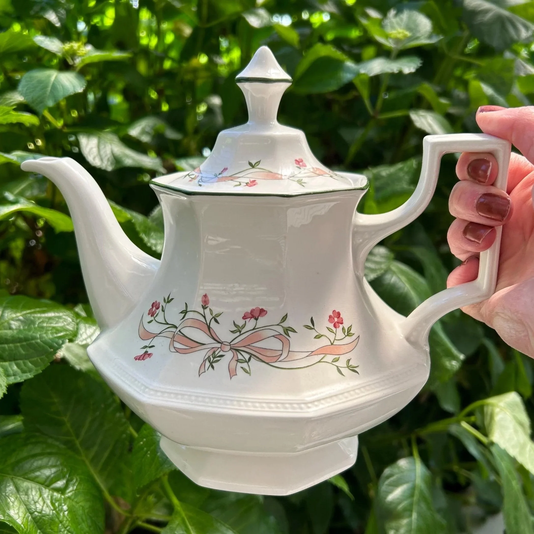 Full side view of Eternal Beau teapot with floral design and finial lid