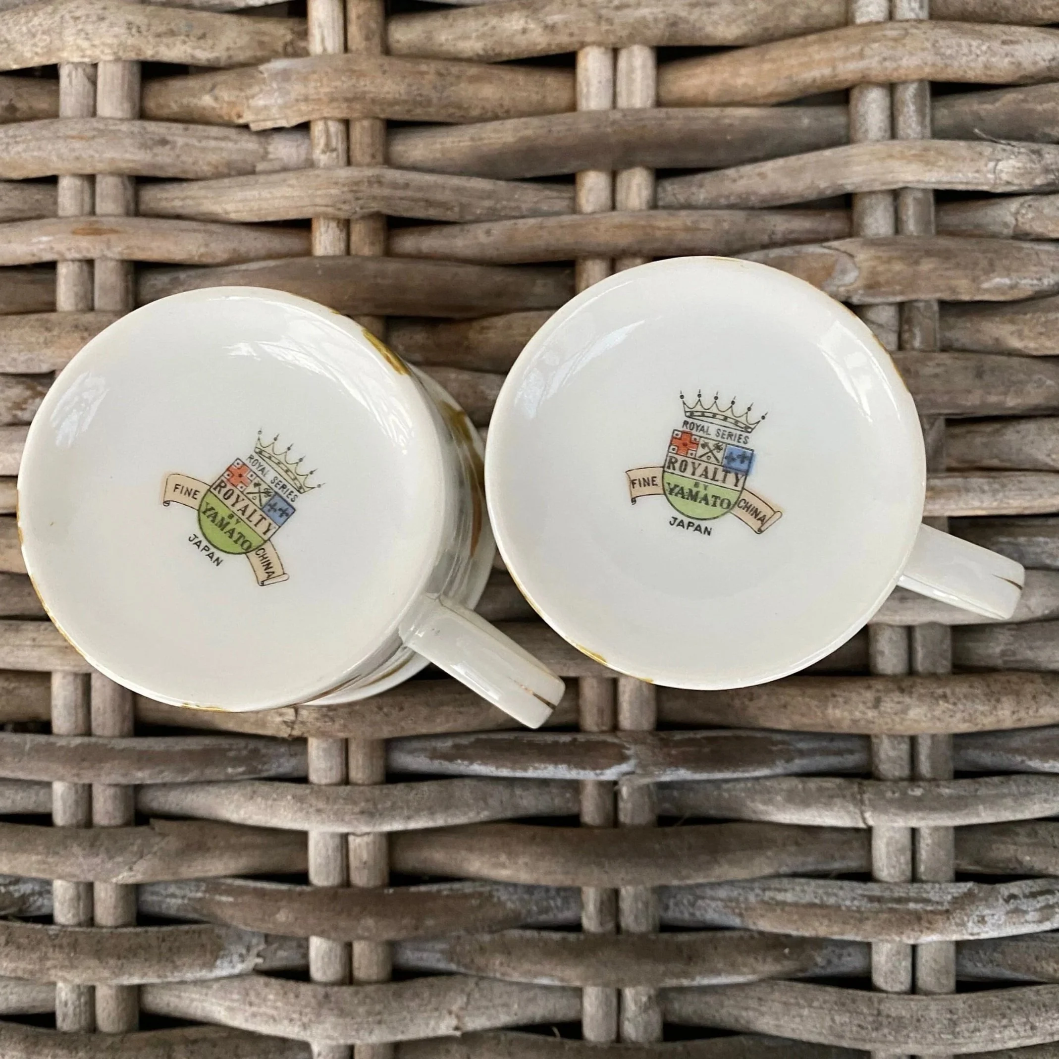 Underside stamps of both cups, showing maker’s marks